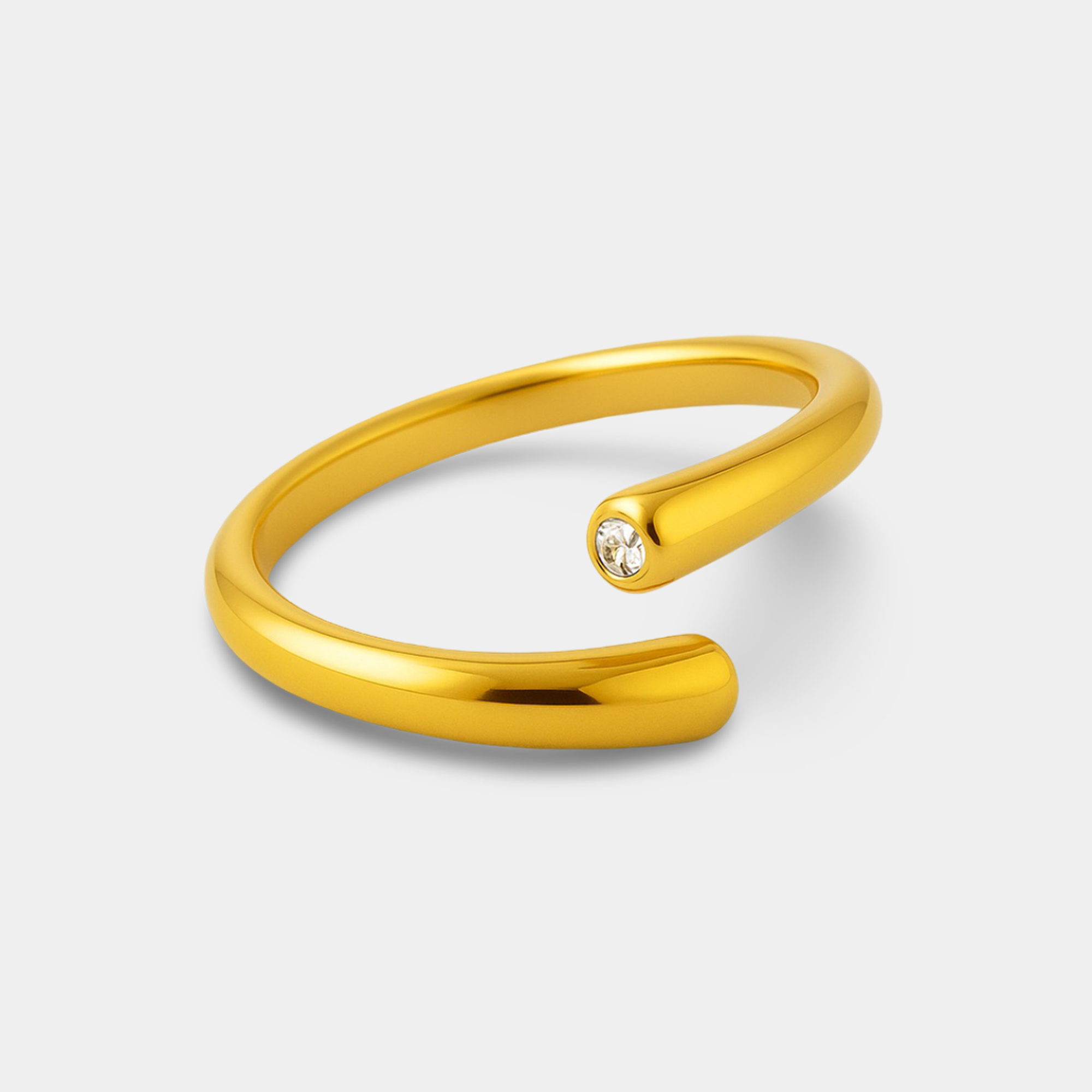 Close-up of dainty 14K gold stacking ring showing band width, polished surface and gold colour