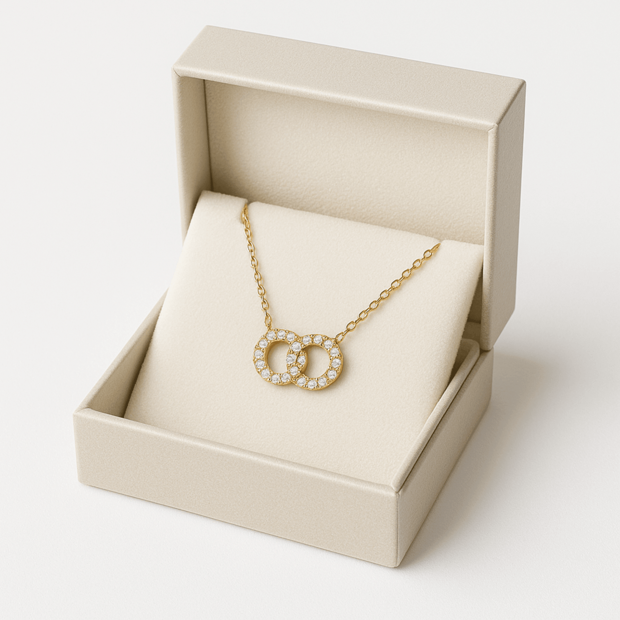 Close-up detail of round geometric gold pendant showing polished finish and gemstone inlay