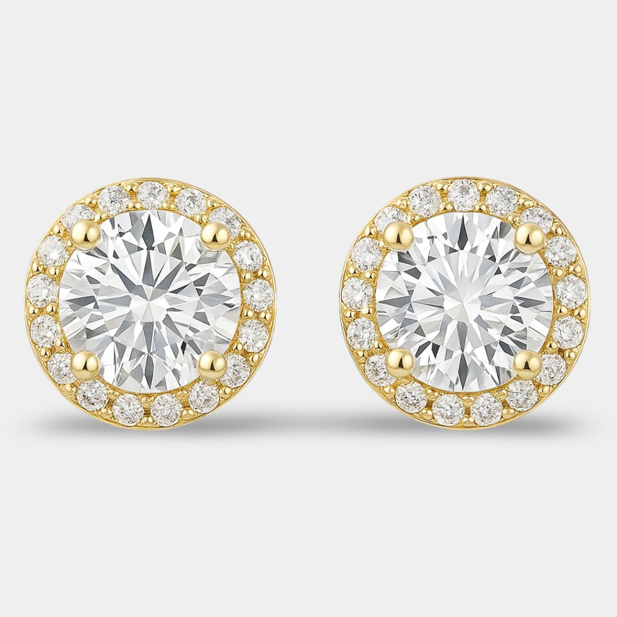 Pair of sterling silver halo stud earrings shown from the front