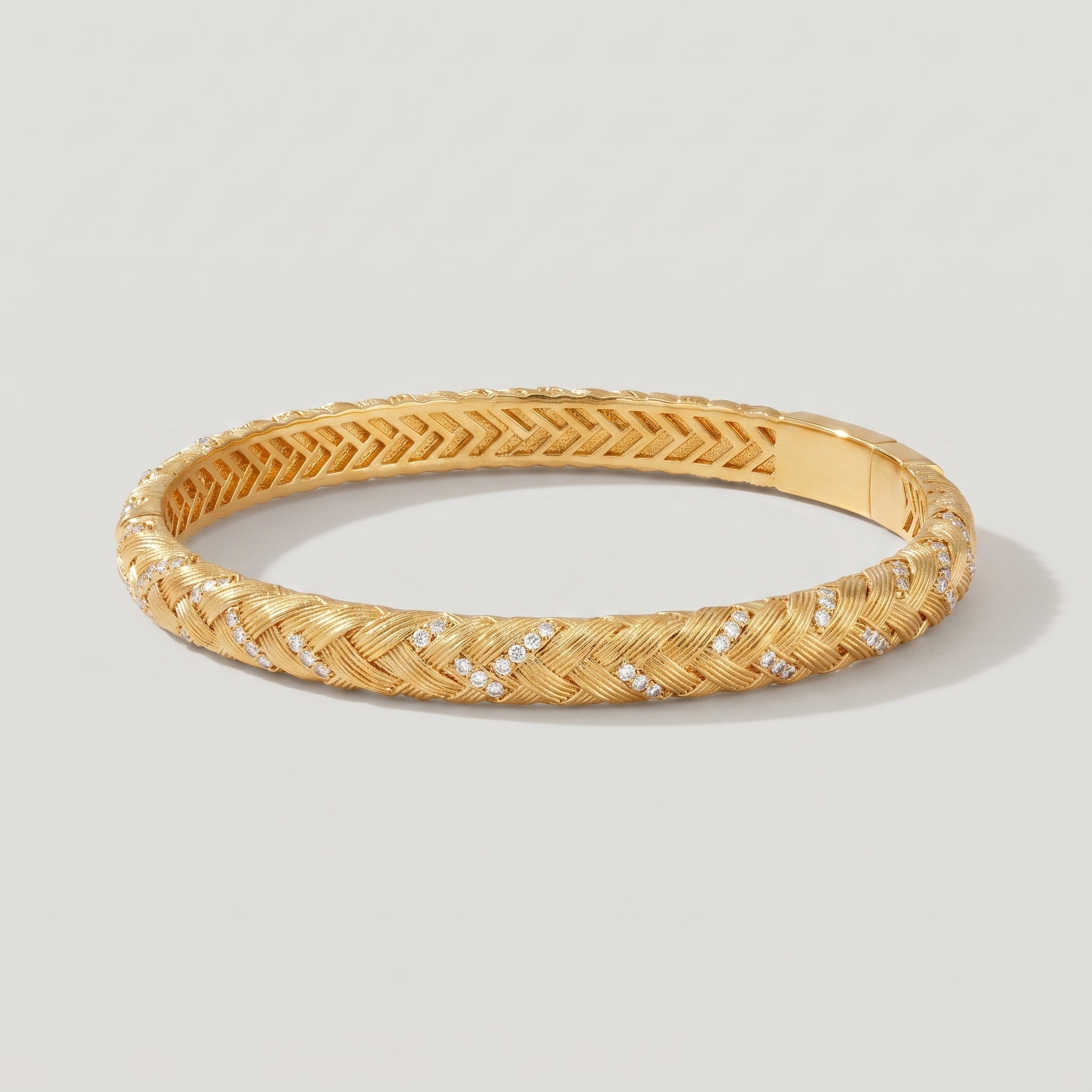 Braided gold bangle bracelet in 18K gold plated brass with pave cubic zirconia stones