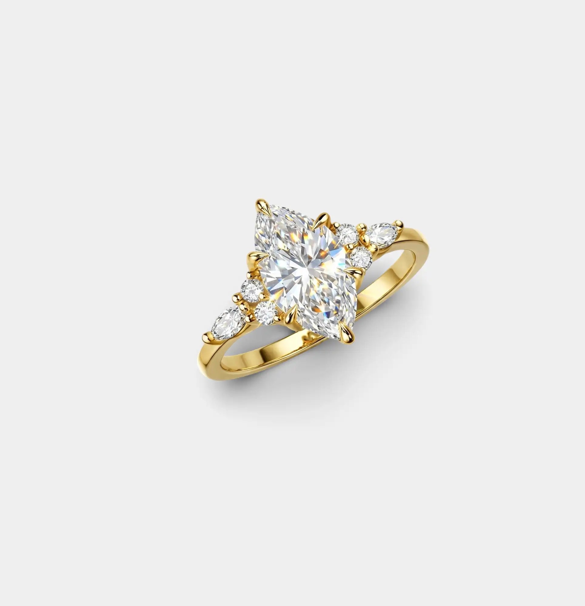 Dainty 18K gold plated marquise ring worn on a woman's hand showing elongating effect on finger