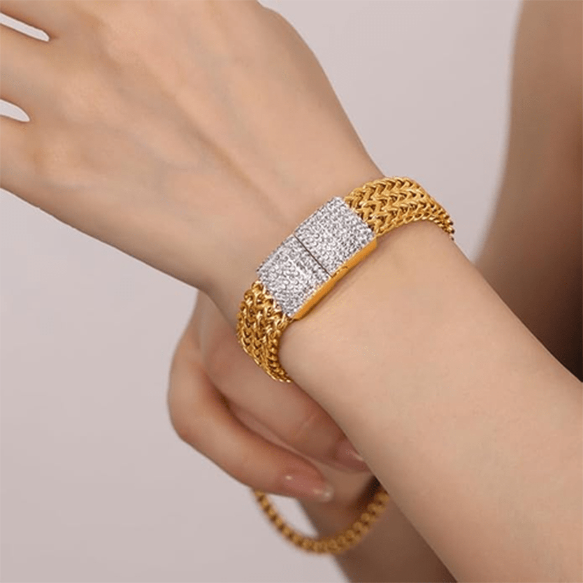 Side view of the 18K gold-plated mesh bracelet showing the hidden safety clasp