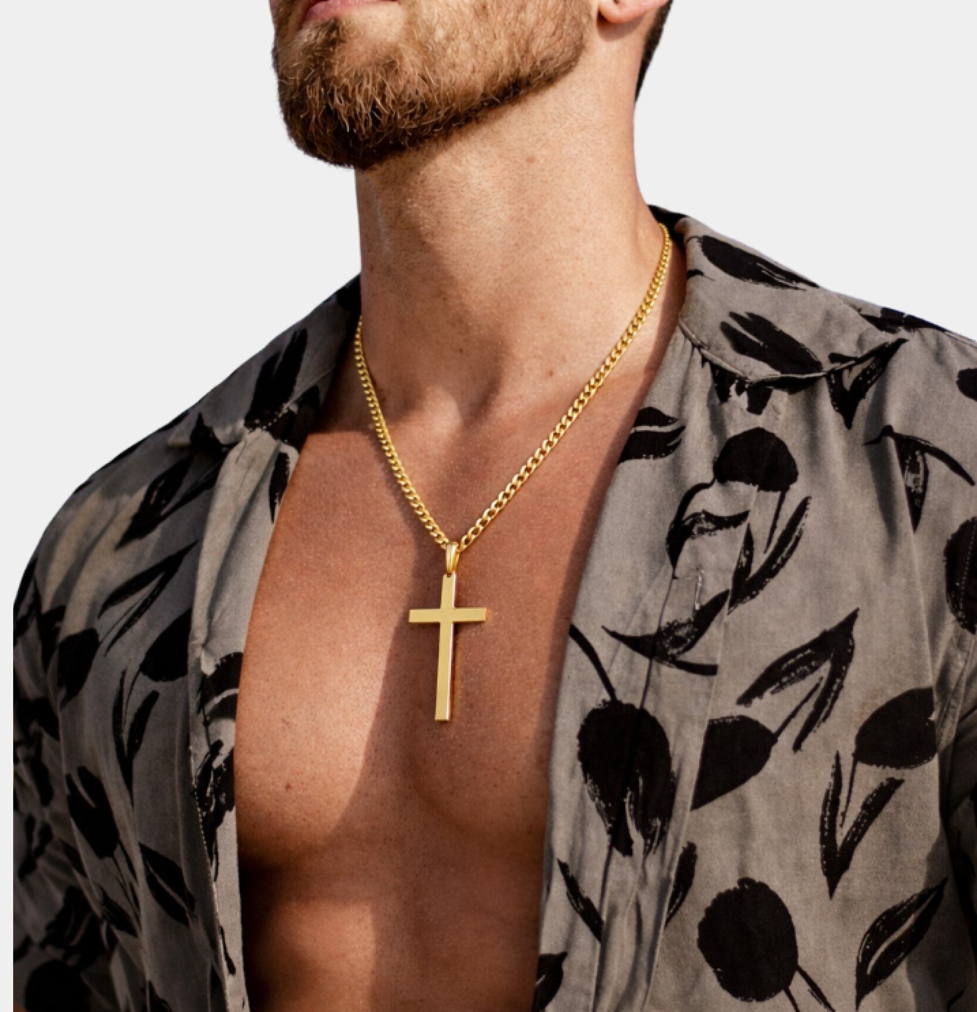 Close-up of the gold cross pendant on the MH Elegance men's necklace