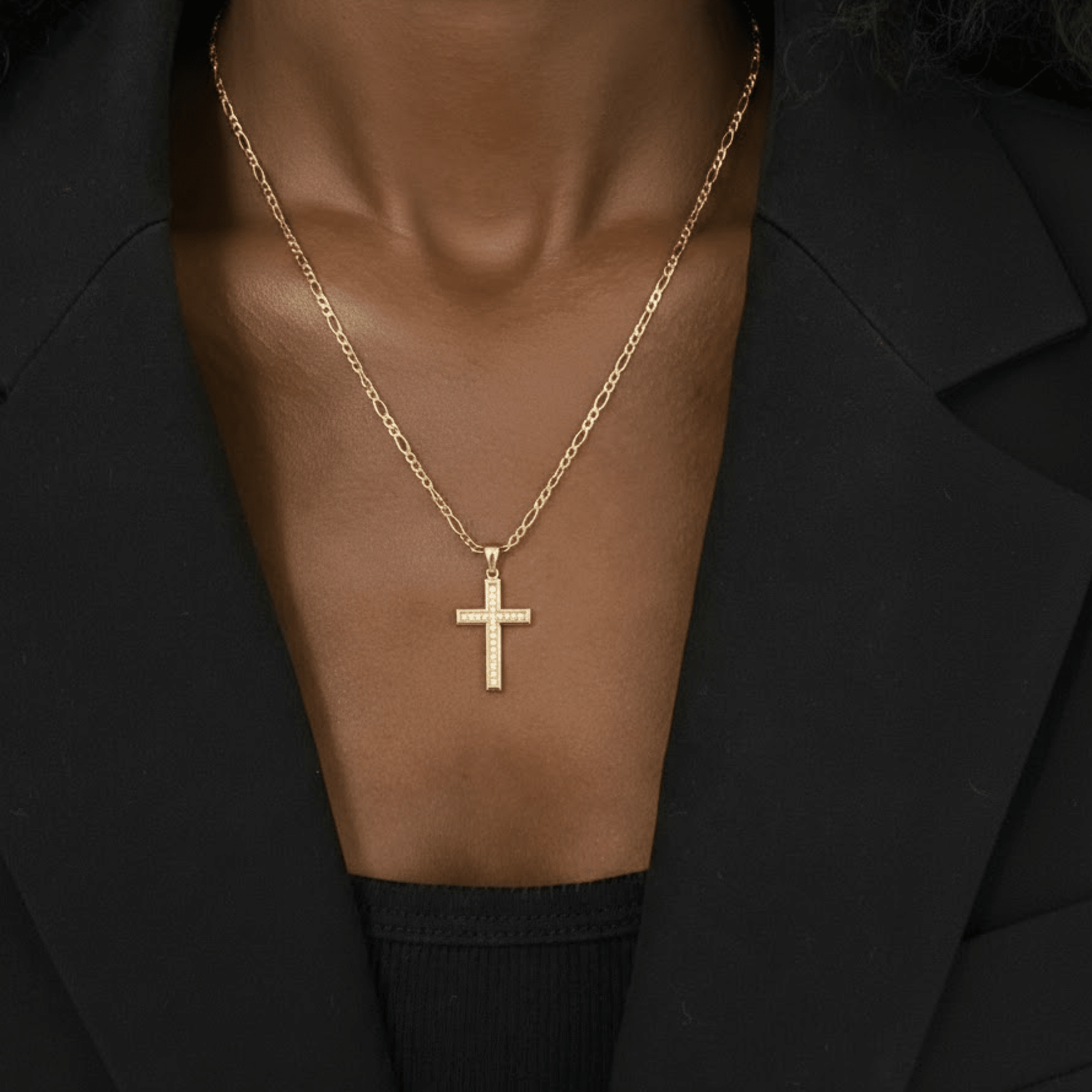 Men's 24K gold plated cross necklace styled flat to show the full chain and pendant