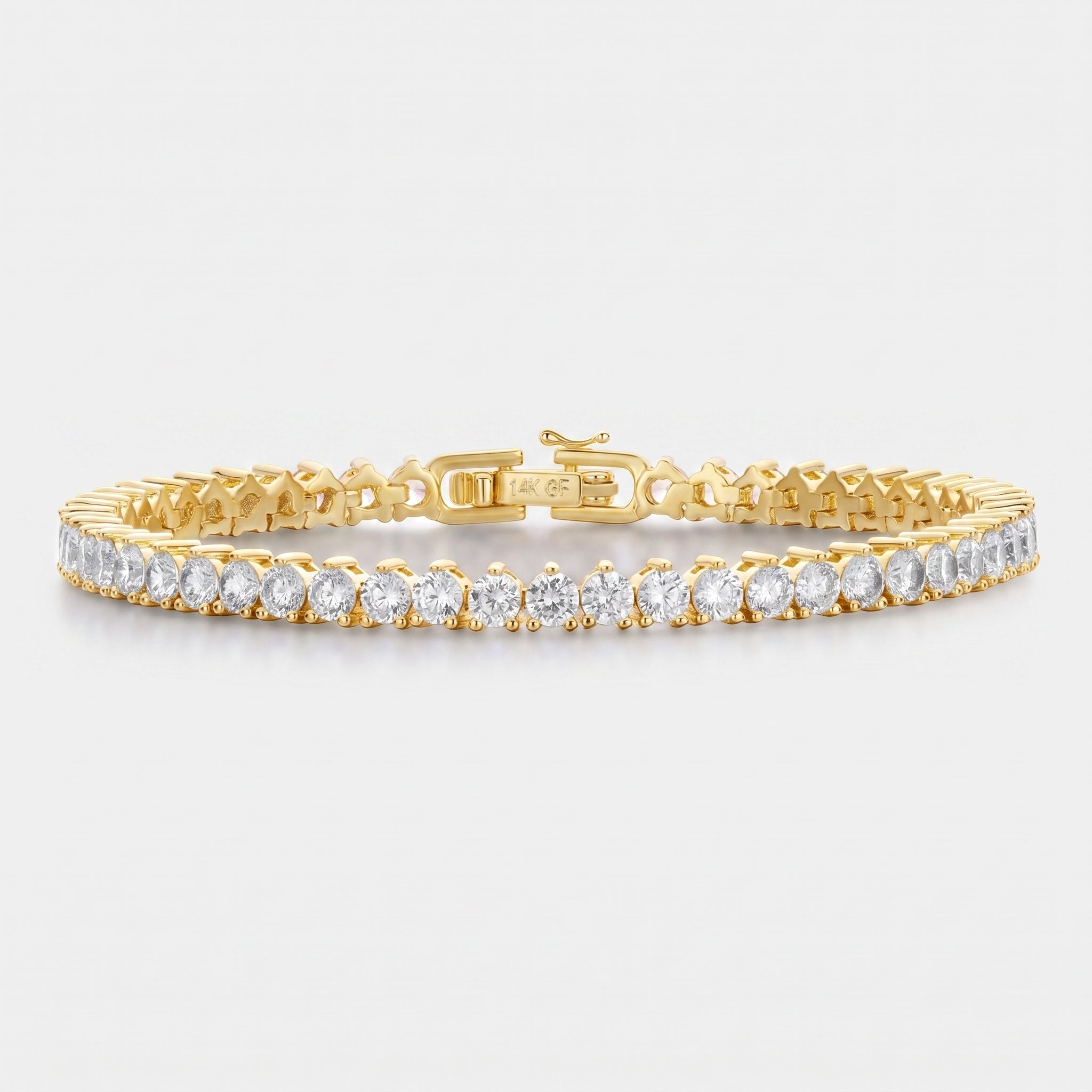 A yellow gold tennis bracelet featuring a row of round-cut clear gemstones, displayed on a clean light gray background.