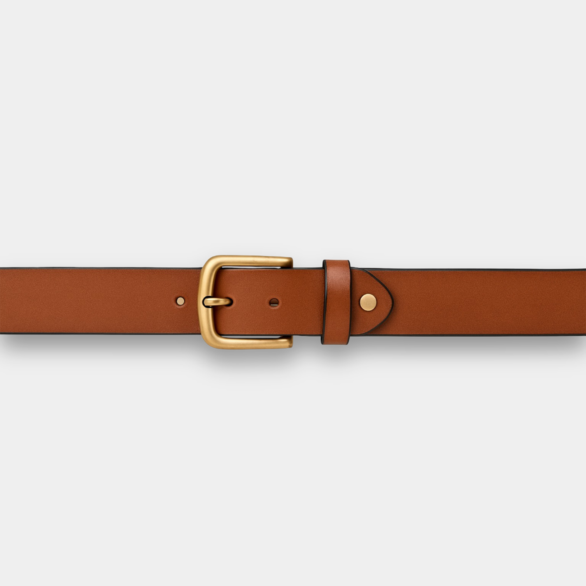 Close-up detail of gold buckle hardware on women's Italian leather belt, showing polished finish and secure mechanism