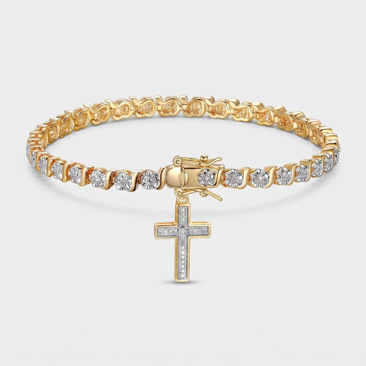 A gold tennis bracelet with clear pavé stones and a dangling cross charm, also set with clear stones, shown on a light gray background.