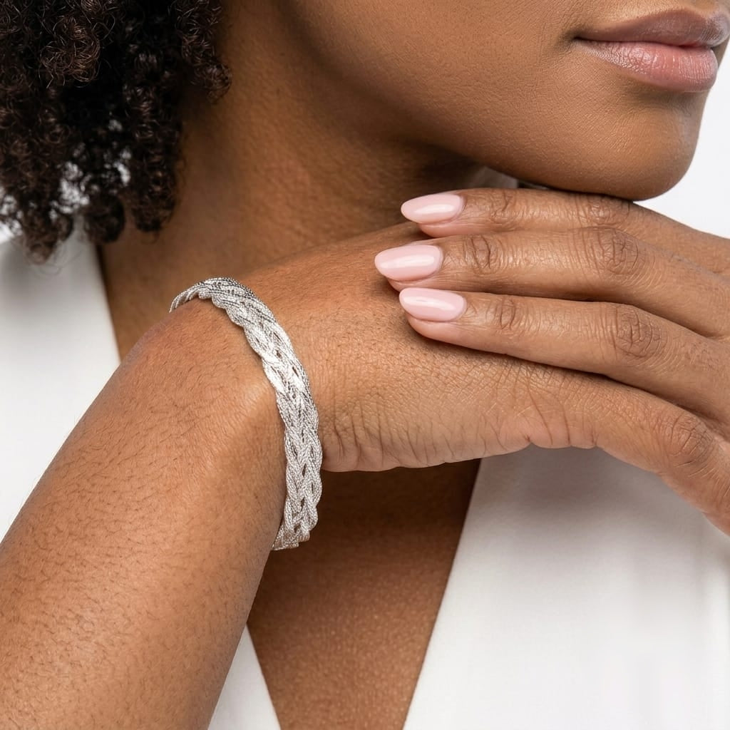 Woman wearing an Italian sterling silver braided herringbone bracelet