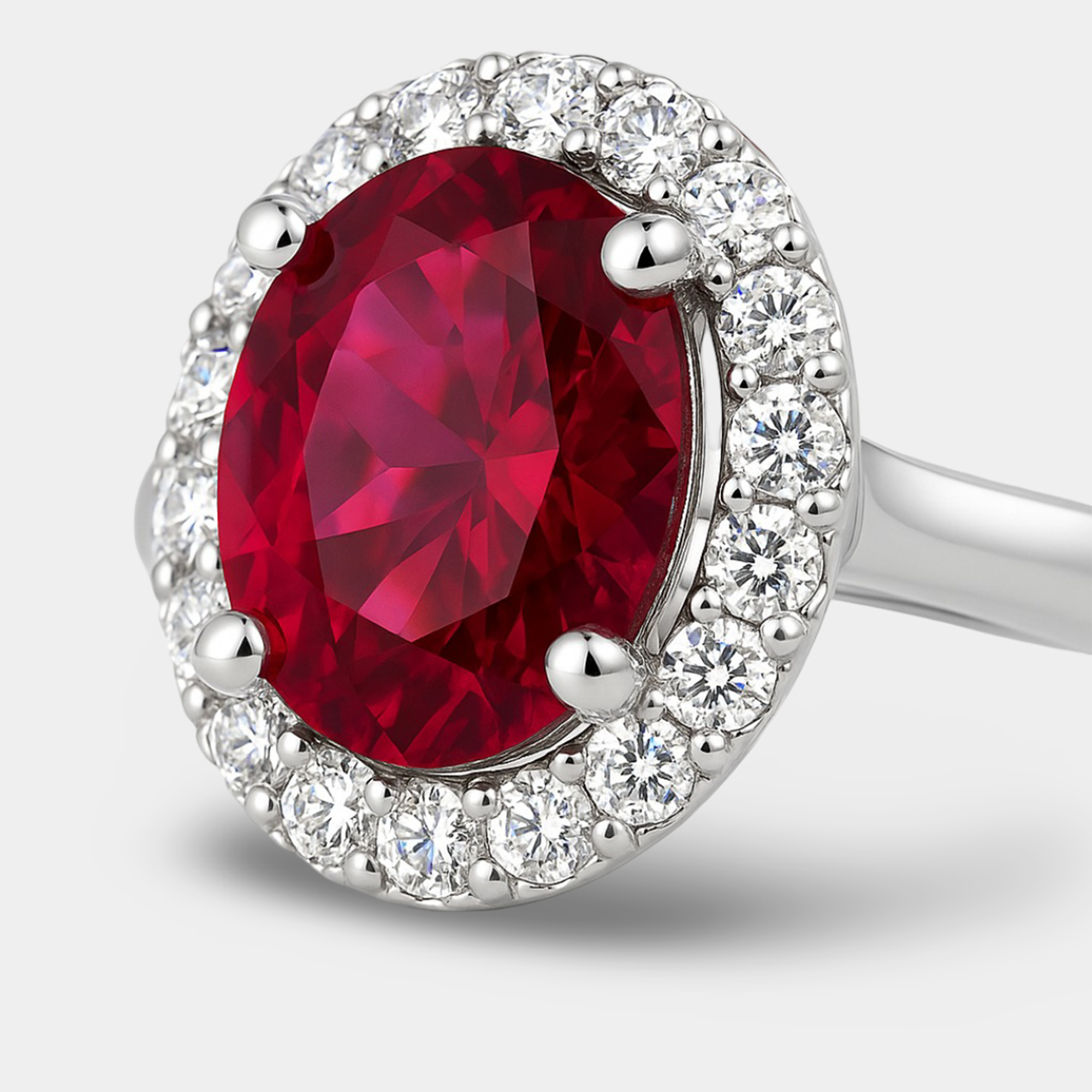 White Gold Oval Ruby & Diamond Halo Ring