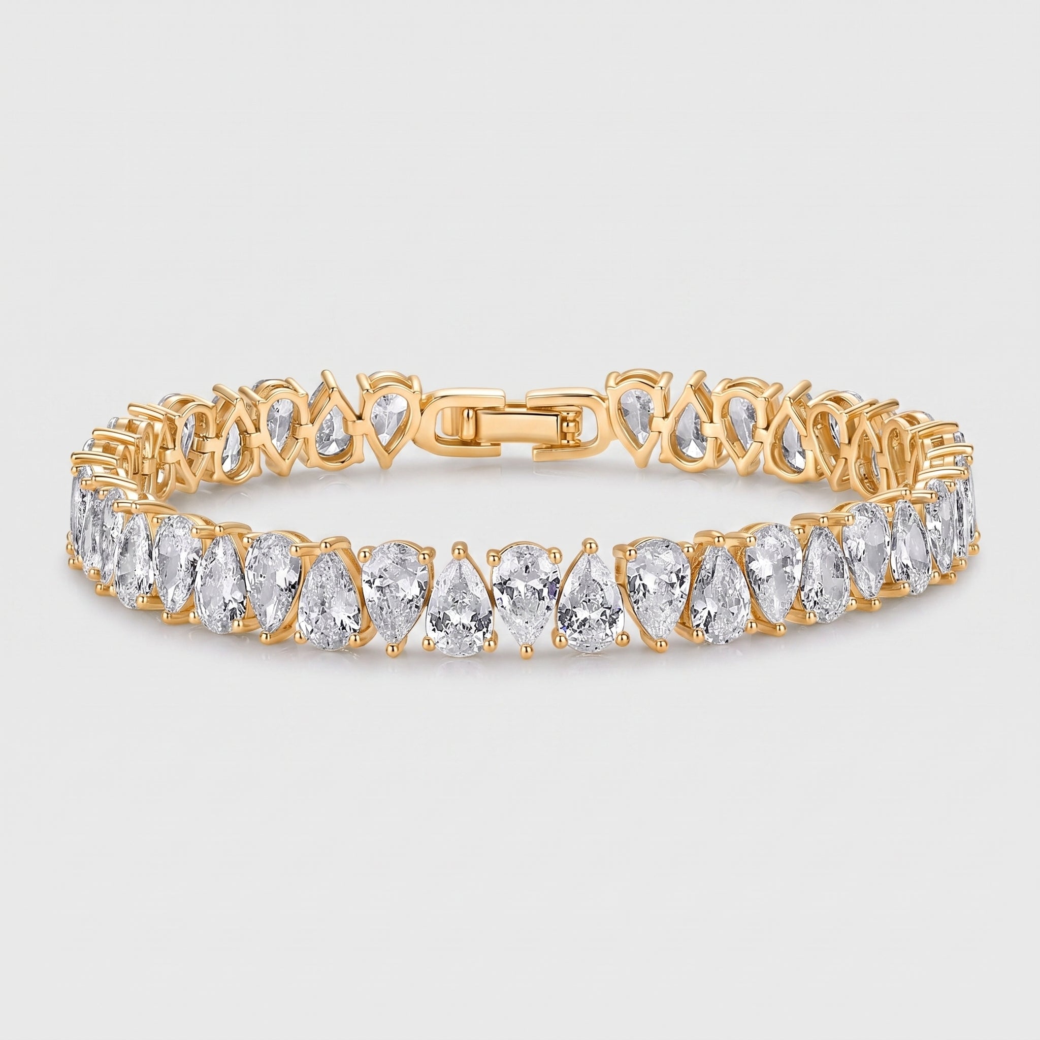 14K gold plated tennis bracelet with pear-cut cubic zirconia stones on white background