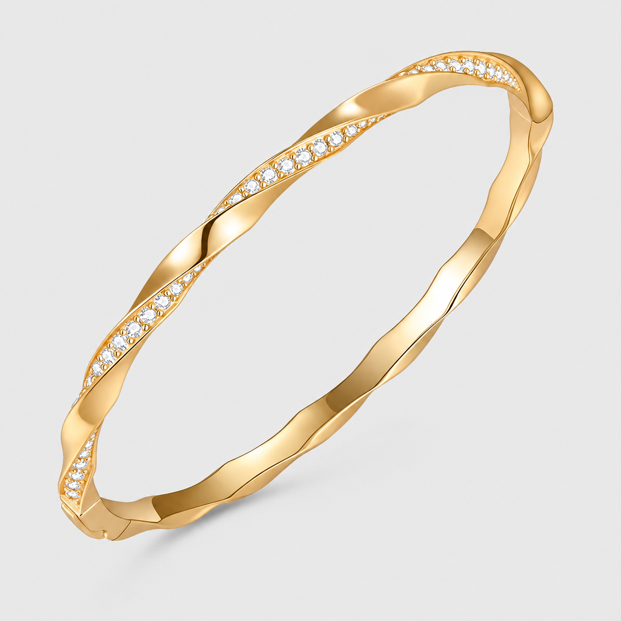 14K gold plated twisted moissanite bangle bracelet for women on a light background