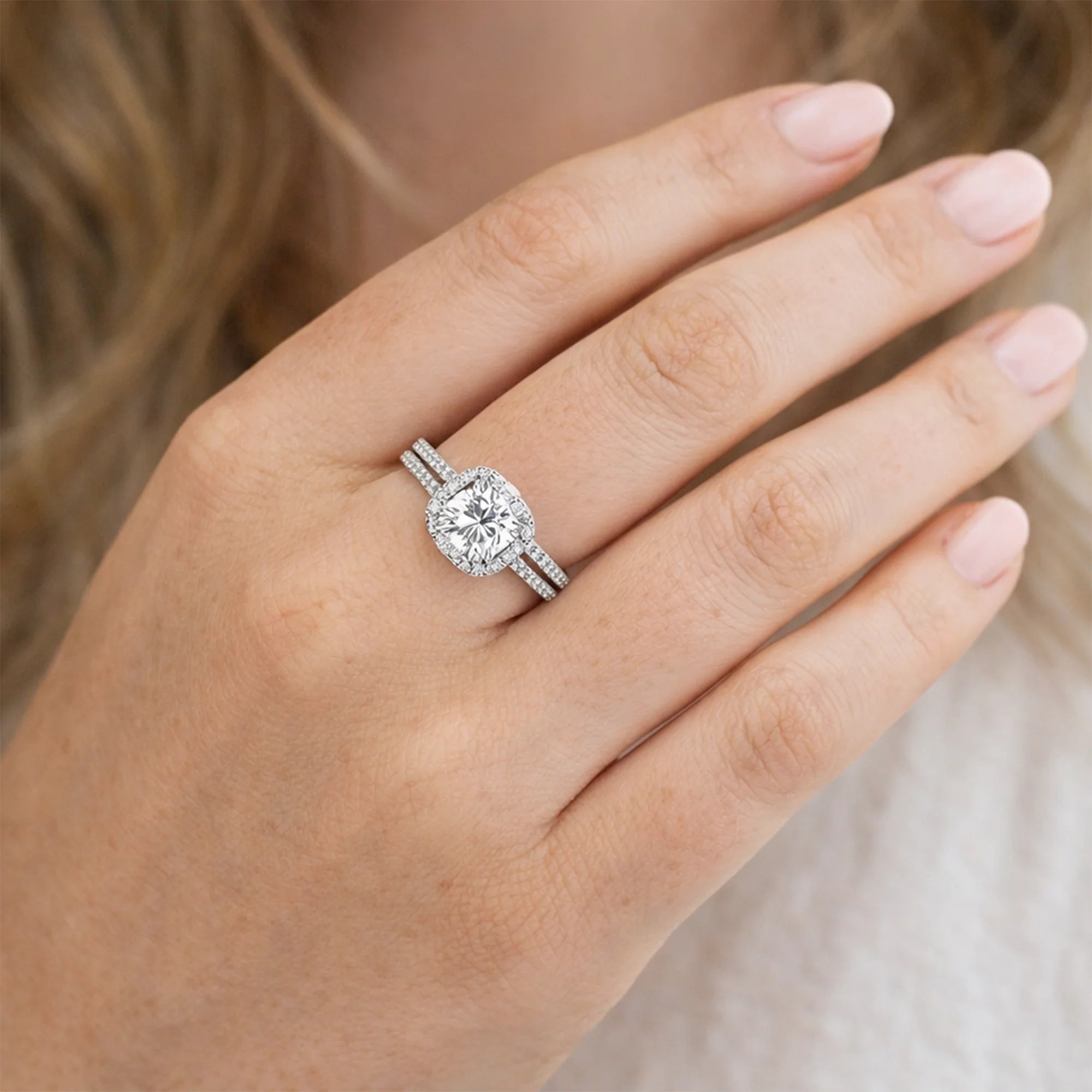 Side view of moissanite halo bridal ring set showing engagement ring and flush-fit wedding band together