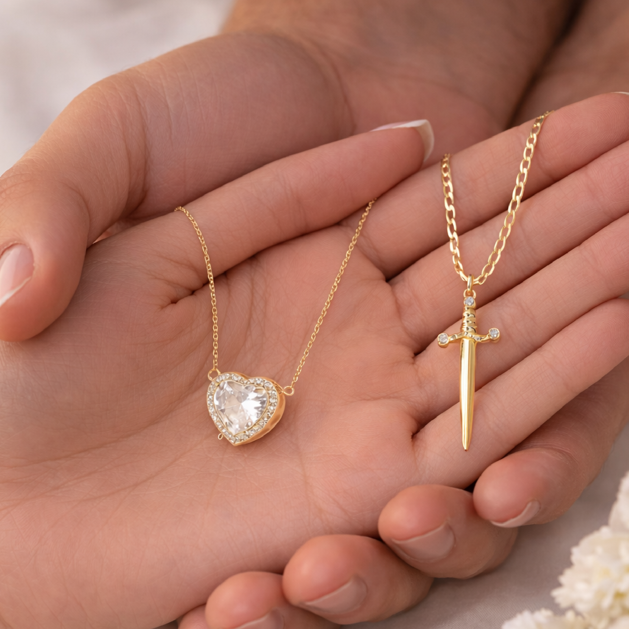 Close-up of 14K gold sword pendant from matching couple jewelry set