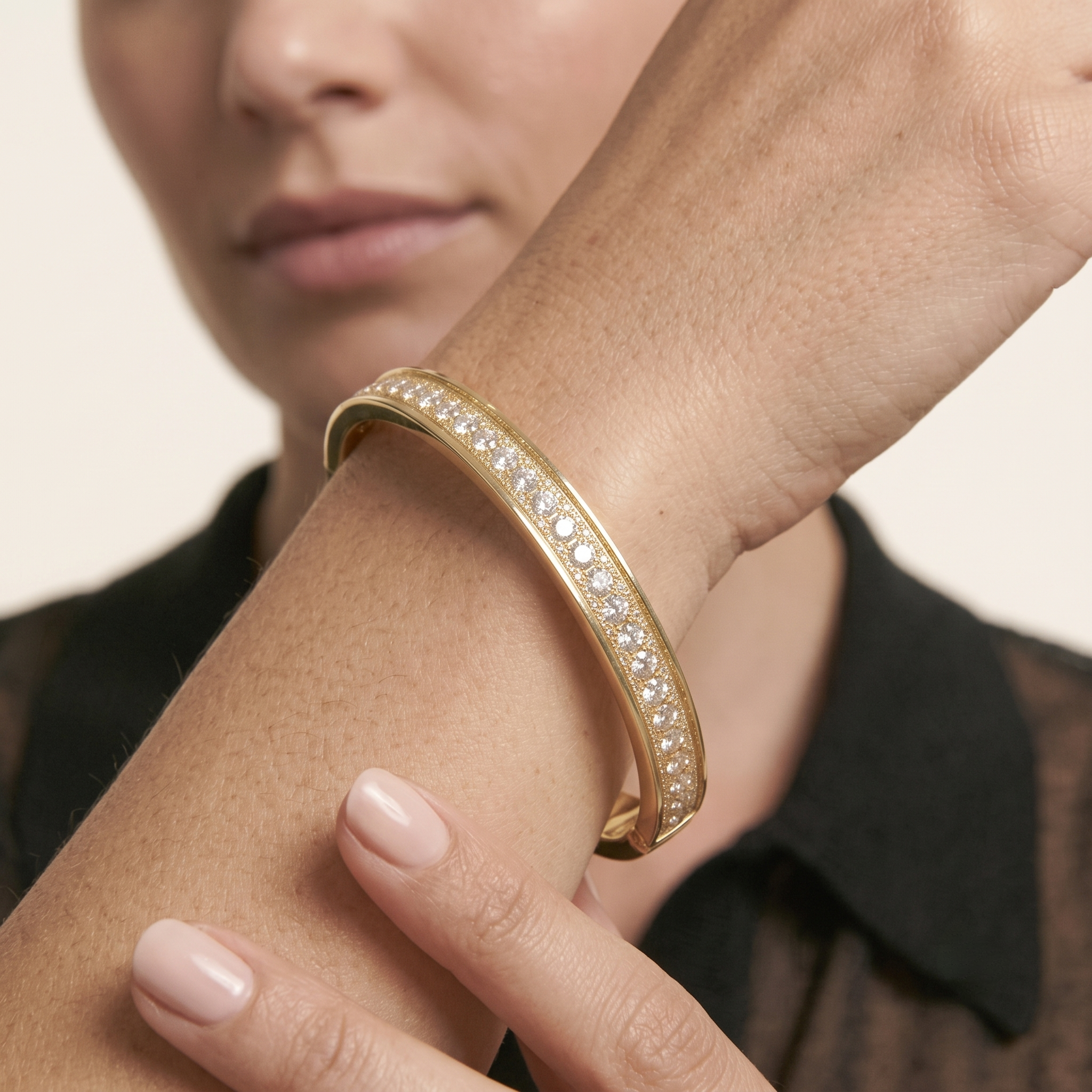 Close-up of the eternity bangle bracelet showing cubic zirconia stones sparkling all the way around the wrist