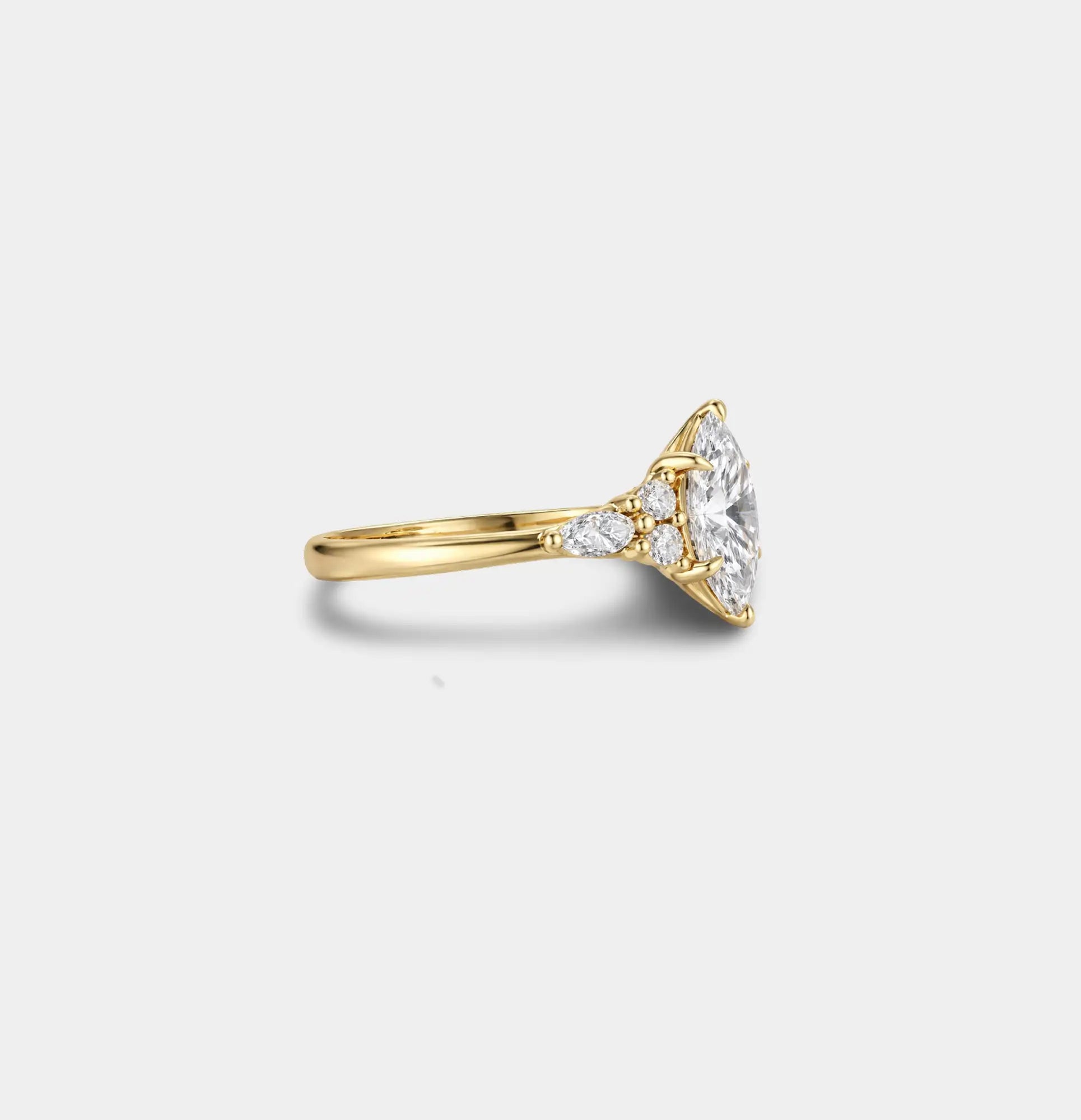 18K gold plated marquise zircon engagement ring on luxury background showing gold tone and stone sparkle