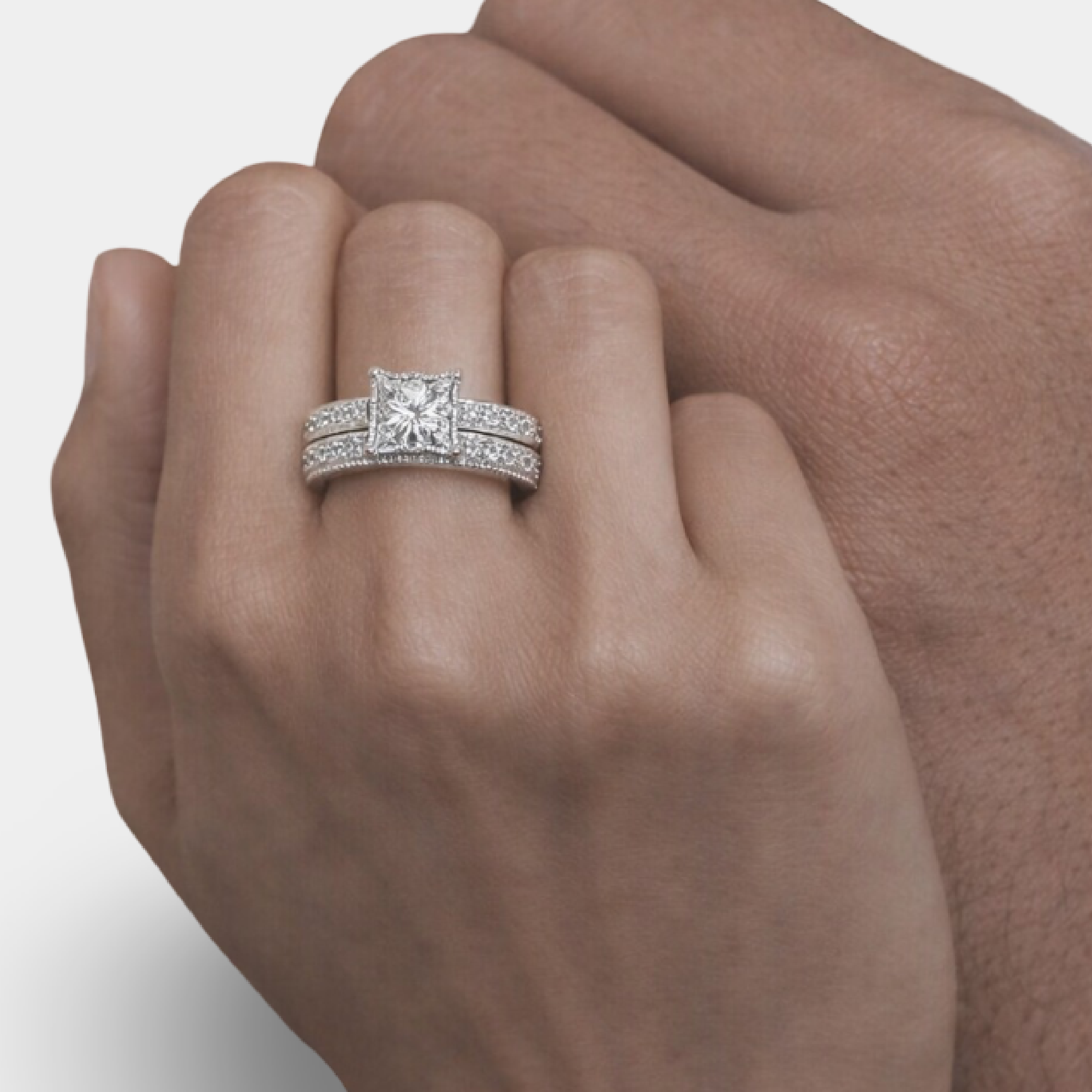 Close-up of princess cut CZ diamond wedding ring for her in 925 sterling silver.