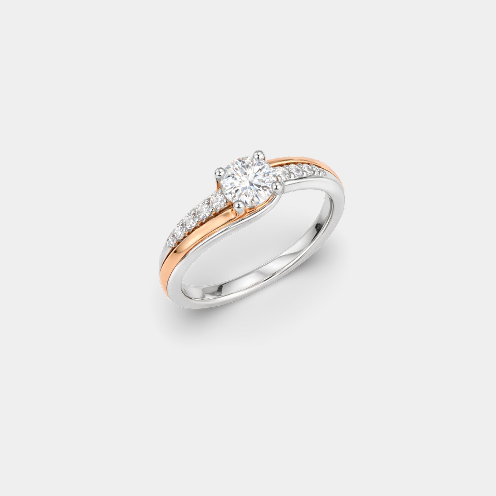 Dainty two-tone rose gold and sterling silver promise ring worn on a woman's hand lifestyle shot