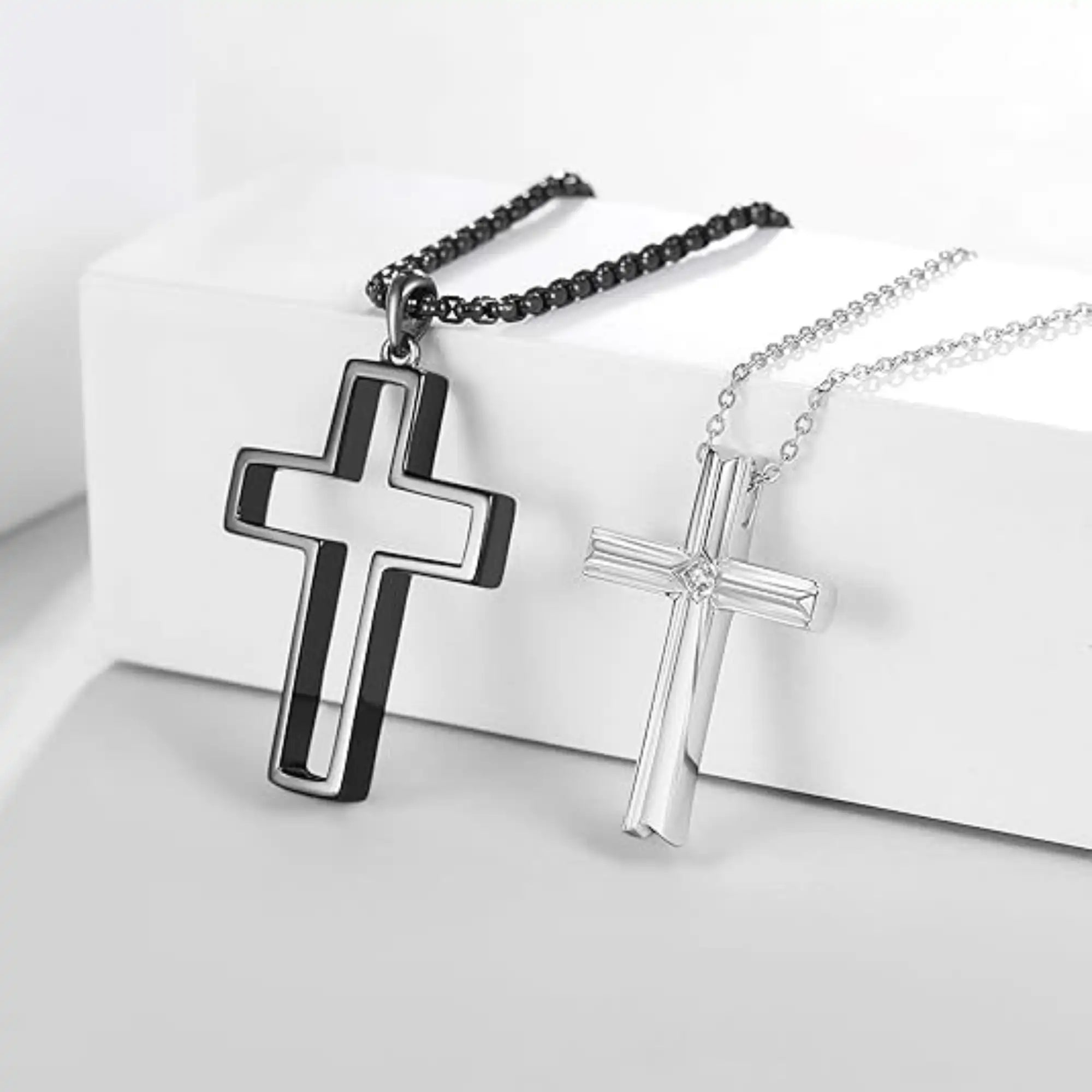 Sterling silver faith cross couple necklace set presented in gift box packaging.