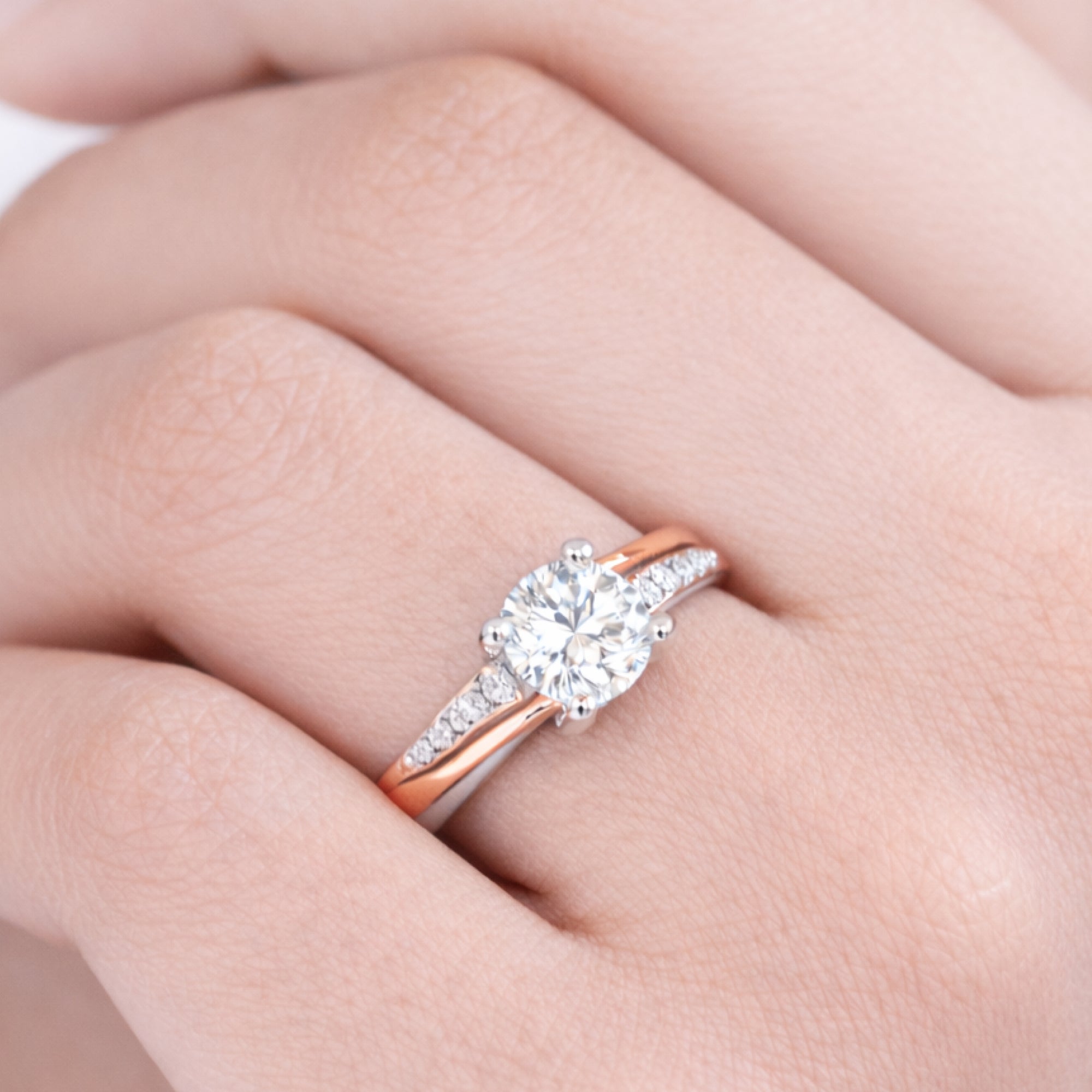 Side profile of blush two-tone sterling silver promise ring showing band width and rose gold tone