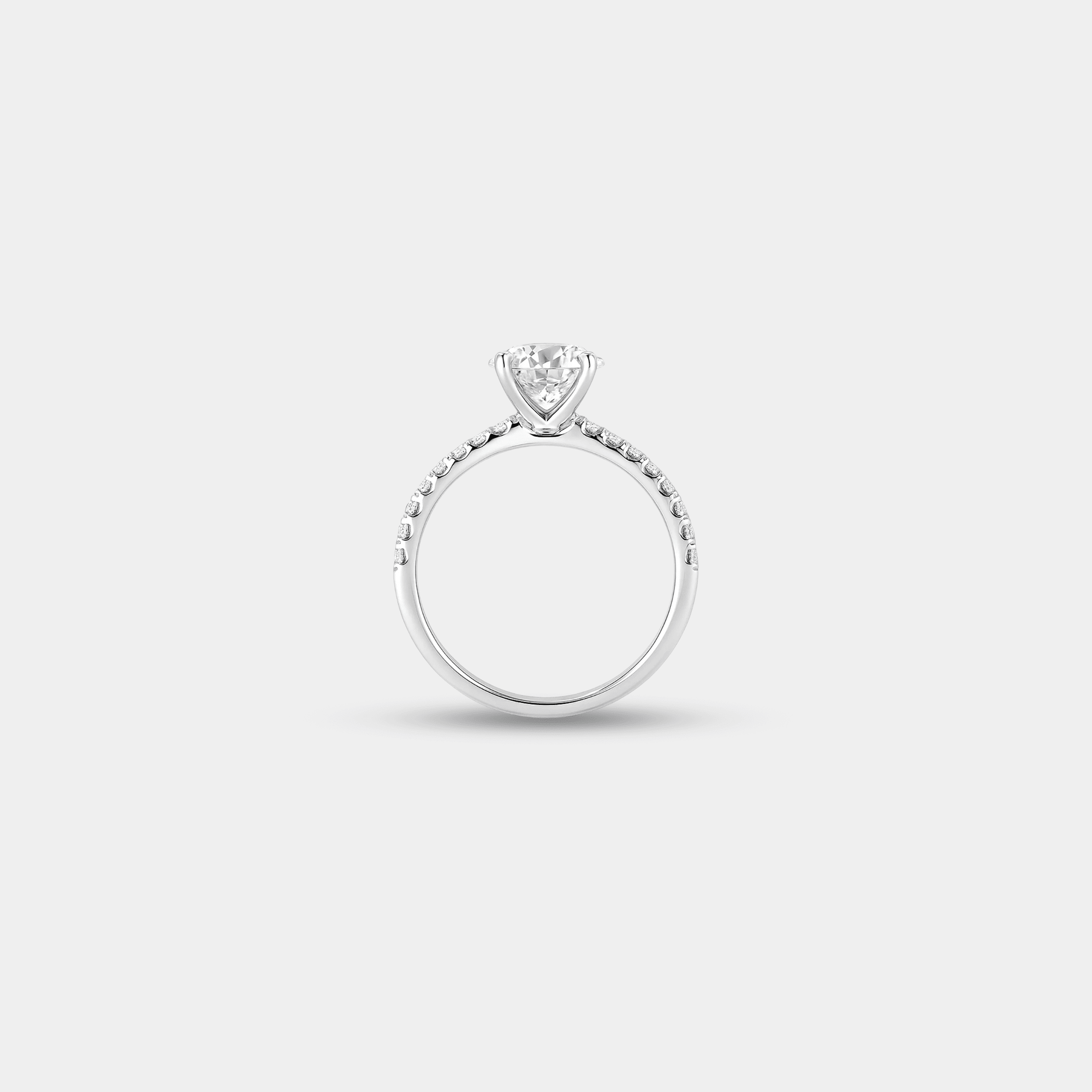 Basket cathedral moissanite engagement ring worn on a woman's hand, showing the sterling silver band and elevated round stone