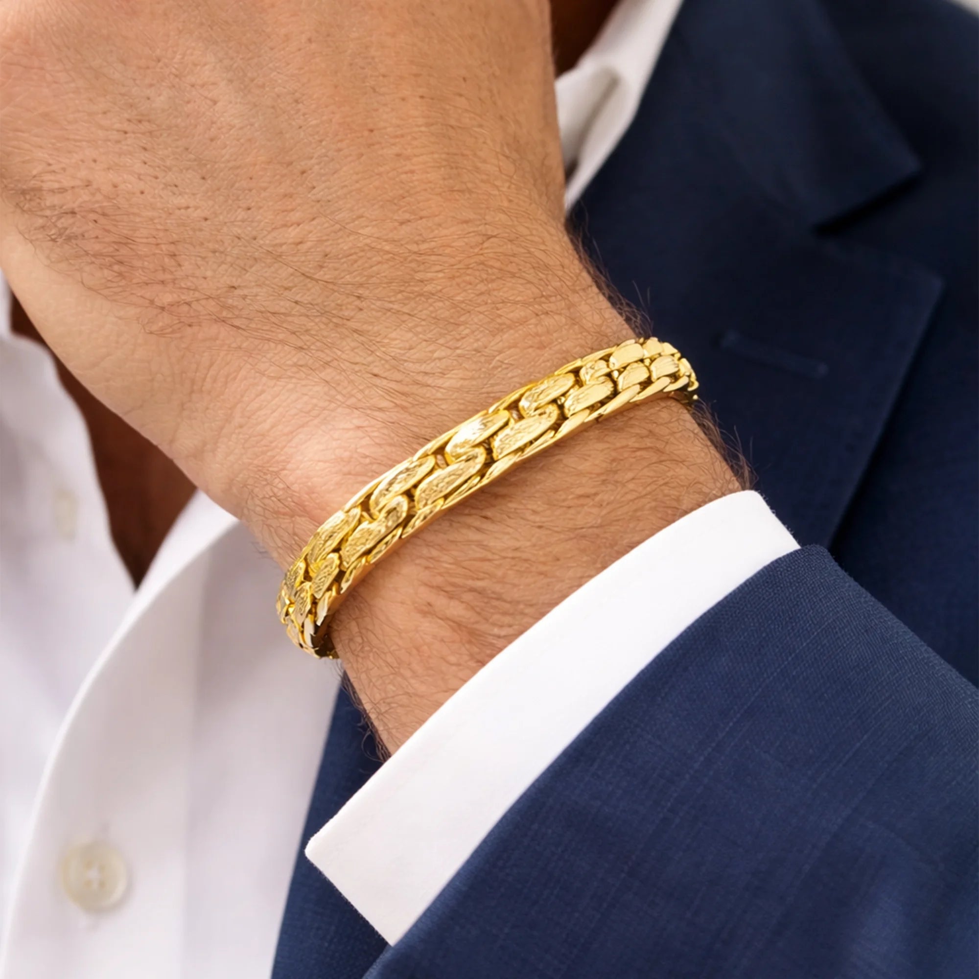 Brushed Riccio gold bracelet shown at an angle to show its heavy, textured chain