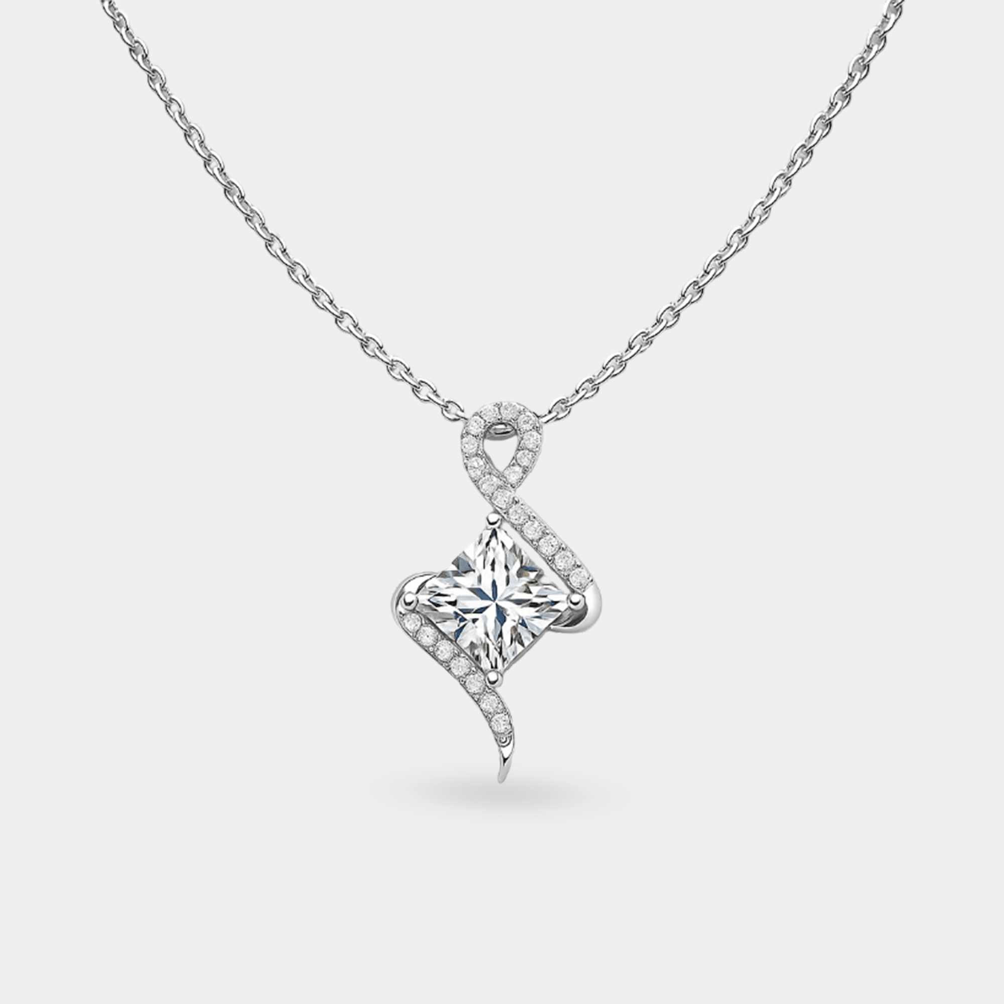 Close-up of the princess-cut moissanite and pave swirl of the twist pendant