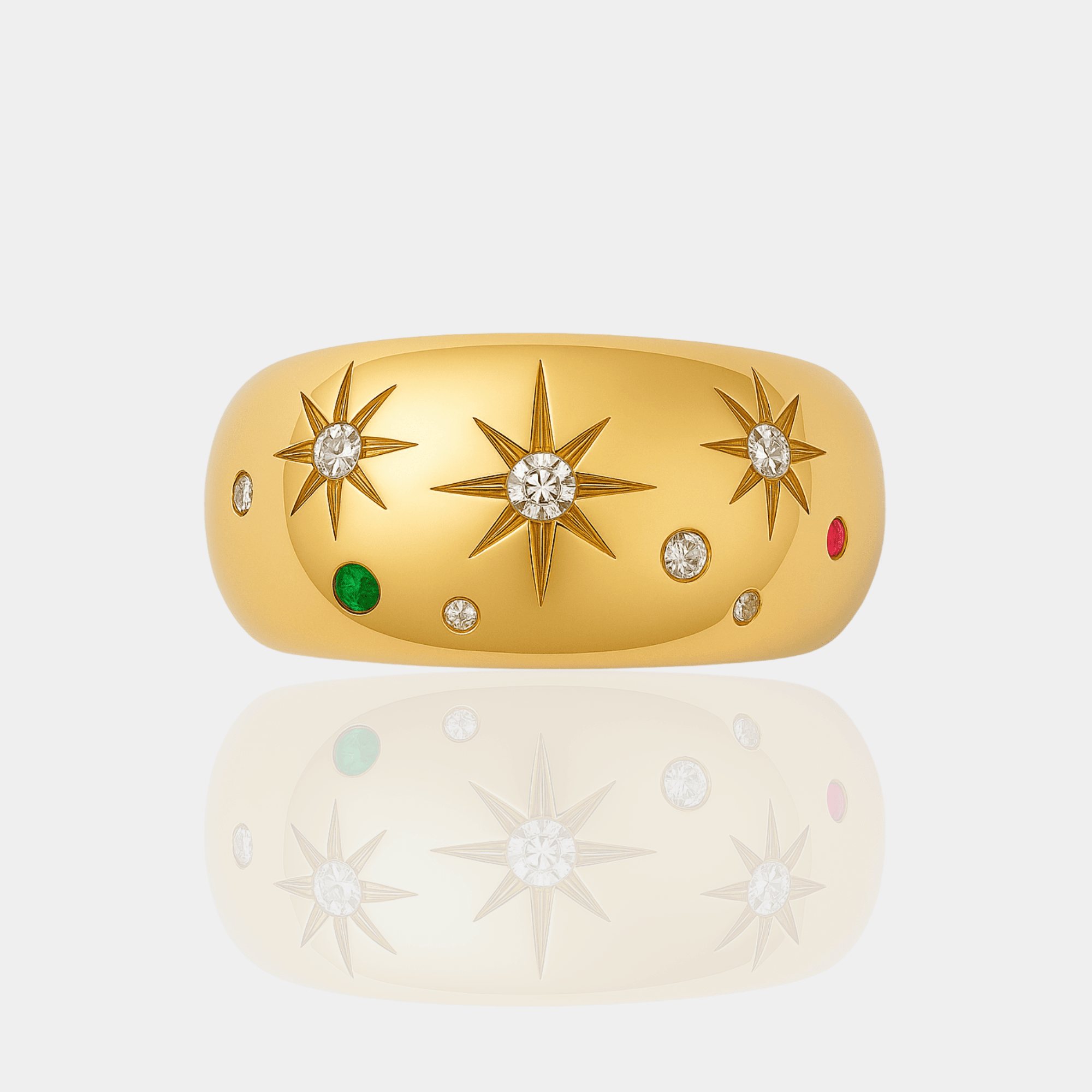 Flat lay of the celestial starburst ring showing all three stars with clear, green, and red accent stones