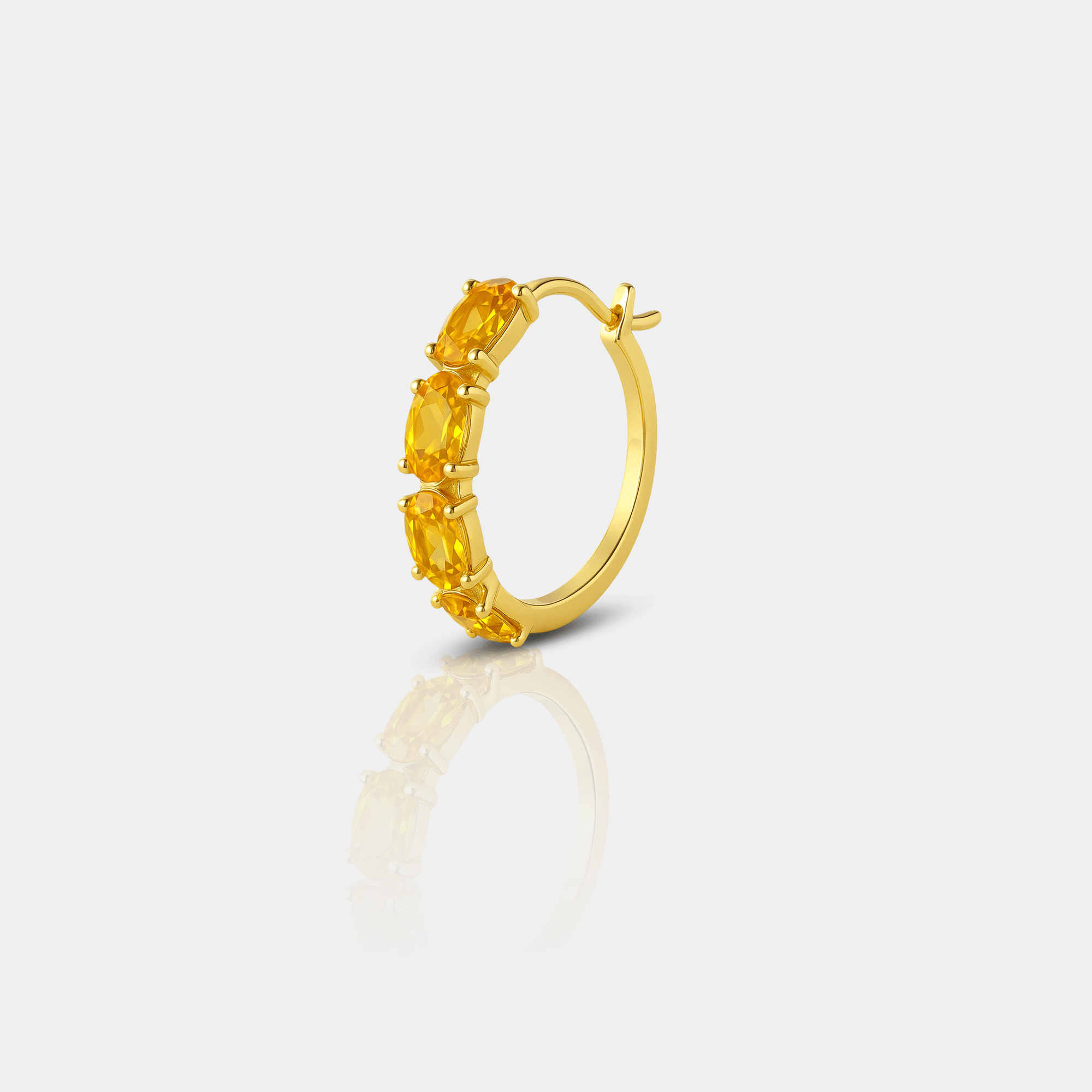 Pair of gold-plated citrine hoop earrings shown side by side.