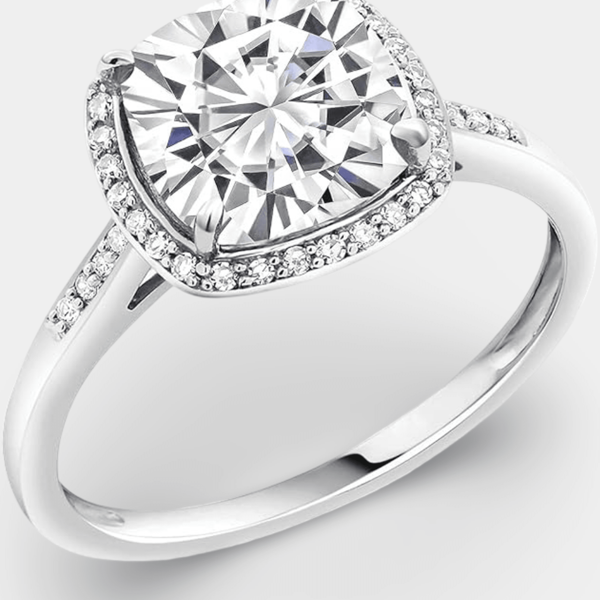 Cushion-cut moissanite halo ring in an MH Elegance gift box