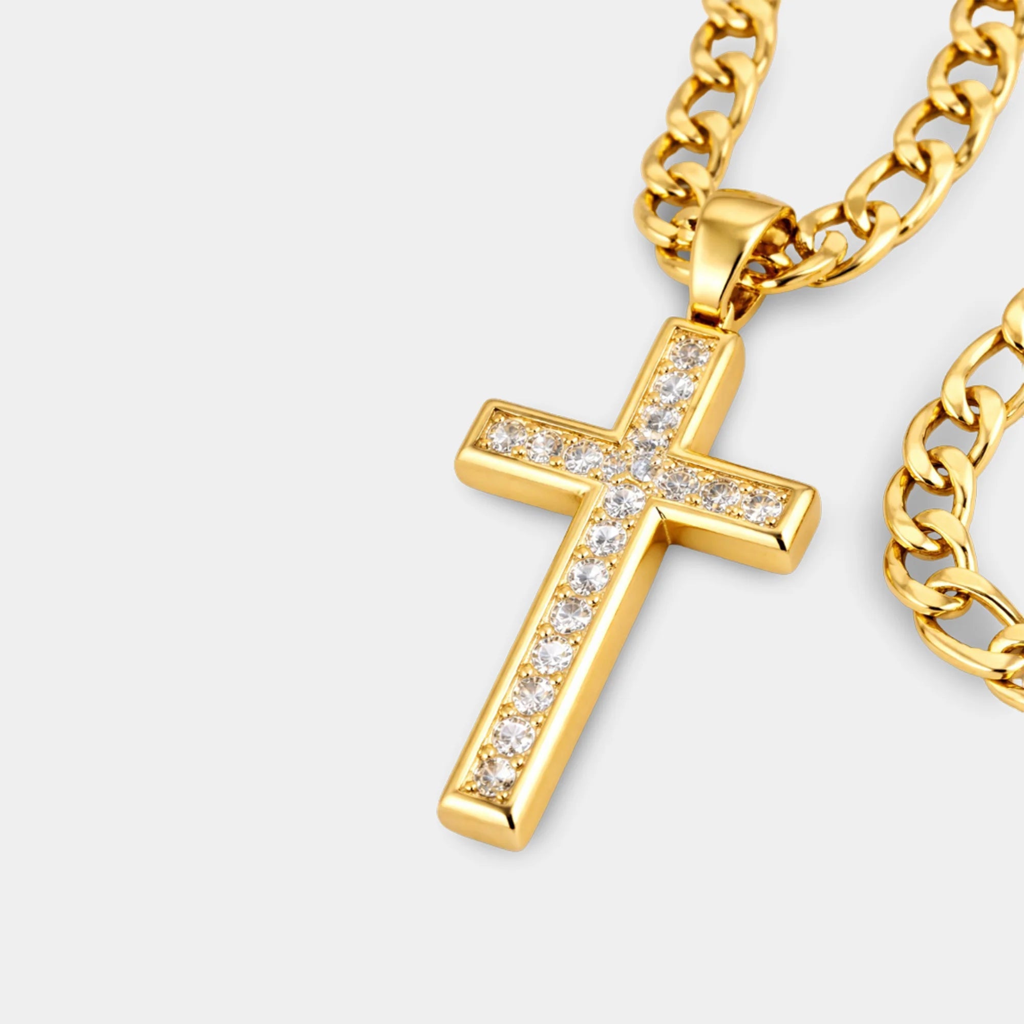 Detail of the gold Figaro chain and lobster clasp on the CZ cross necklace