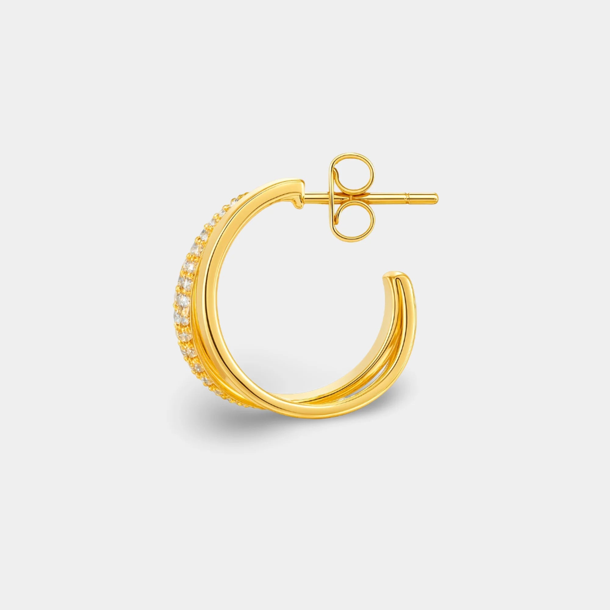 Close view of sparkling cubic zirconia on gold double cuff statement hoops for women