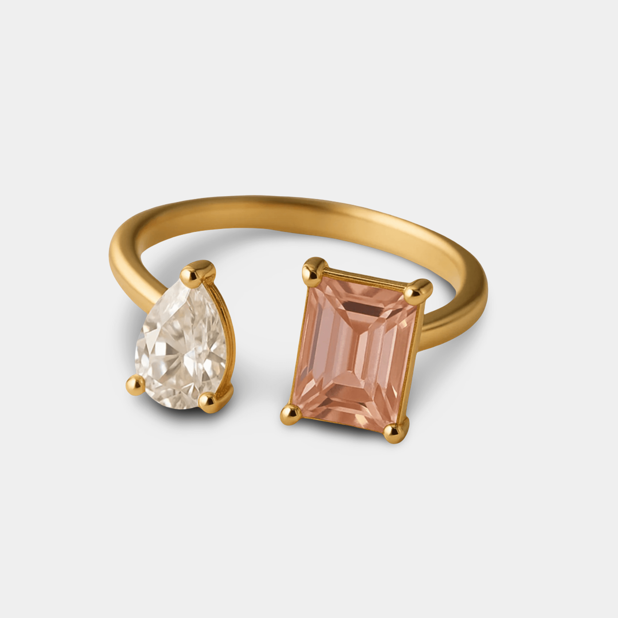 Adjustable gold open duo ring for women on a flat surface