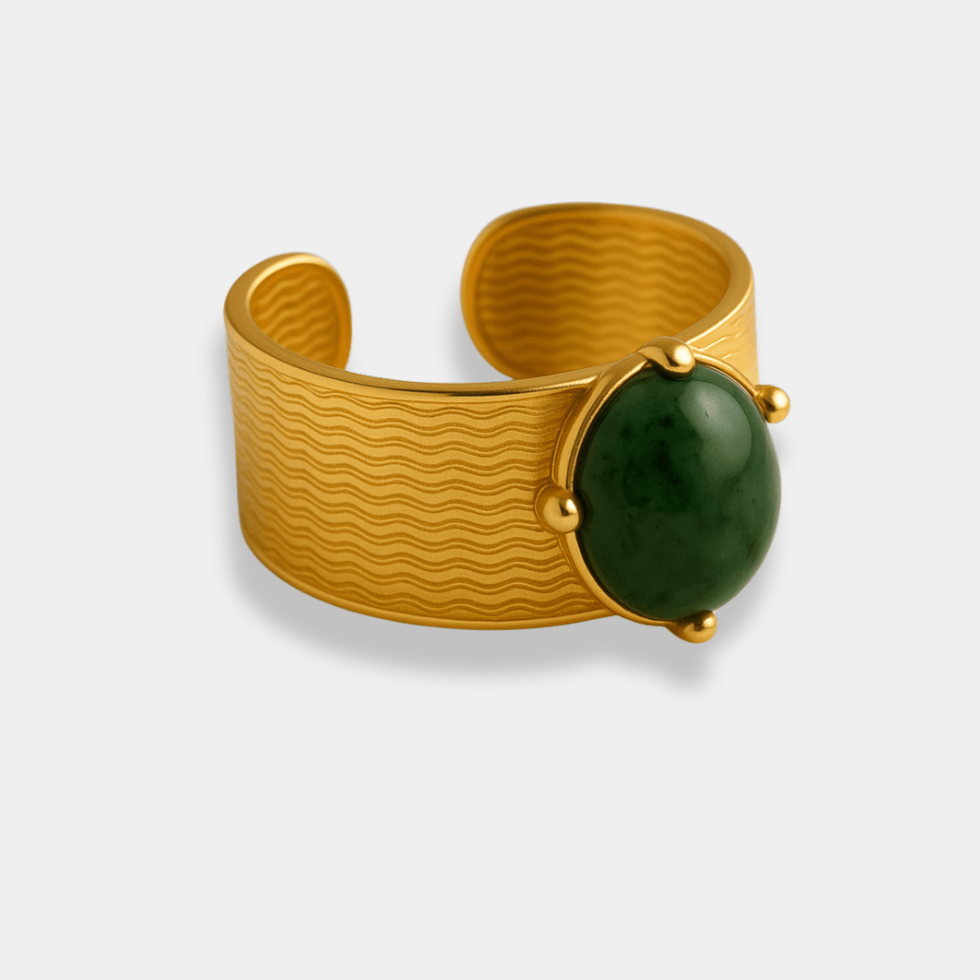Jade gemstone cuff ring with an oval natural jade cabochon prong-set on a textured 18K gold plated band