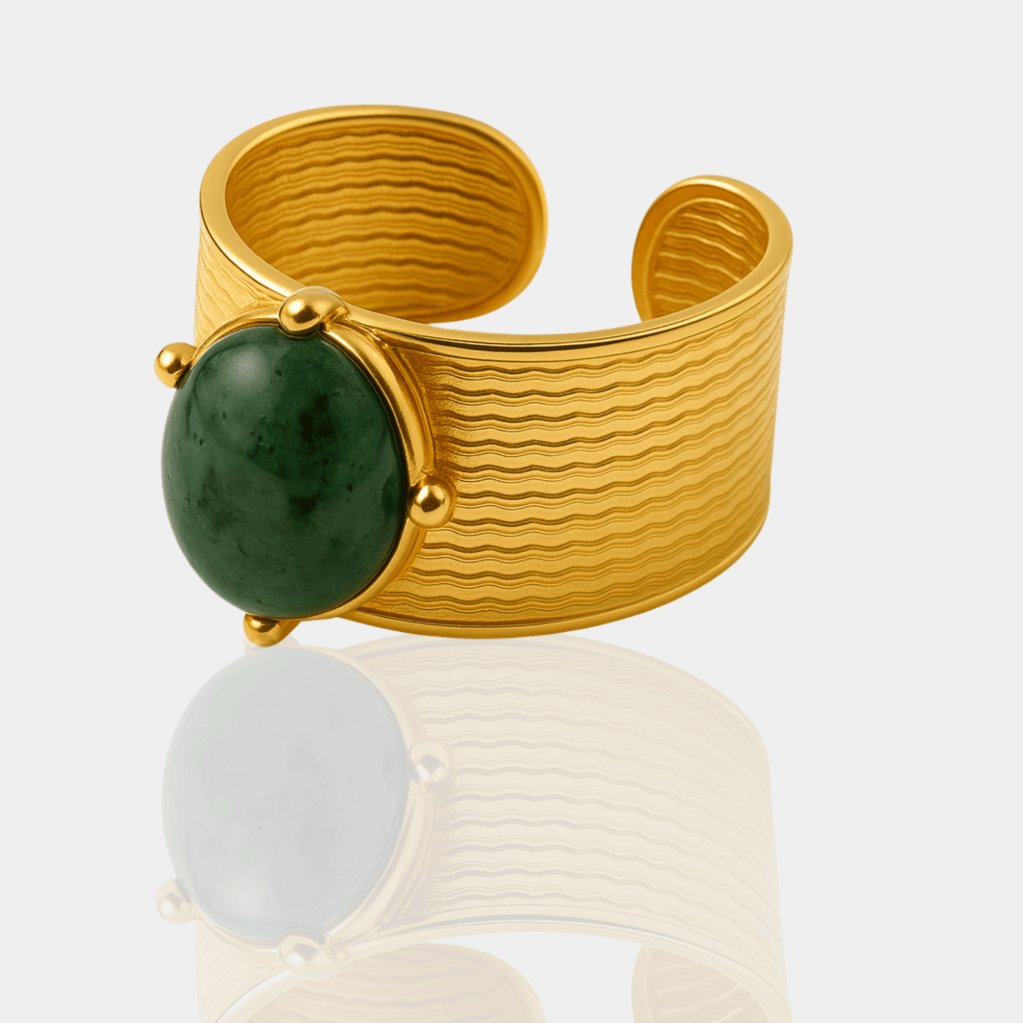 Angled view of the adjustable open band ends and retro texture on the gold jade cuff ring