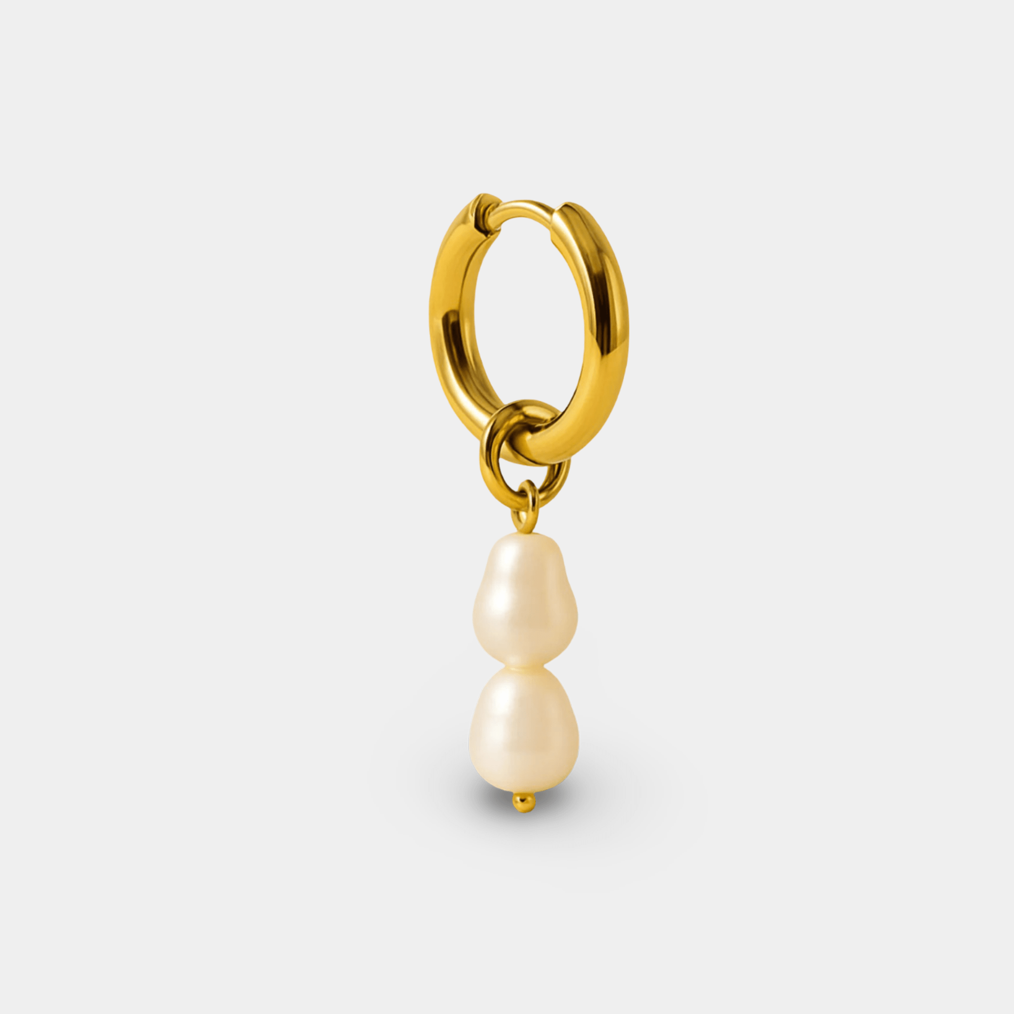 Close-up of one non-tarnish gold hoop earring with two genuine freshwater pearls hanging below