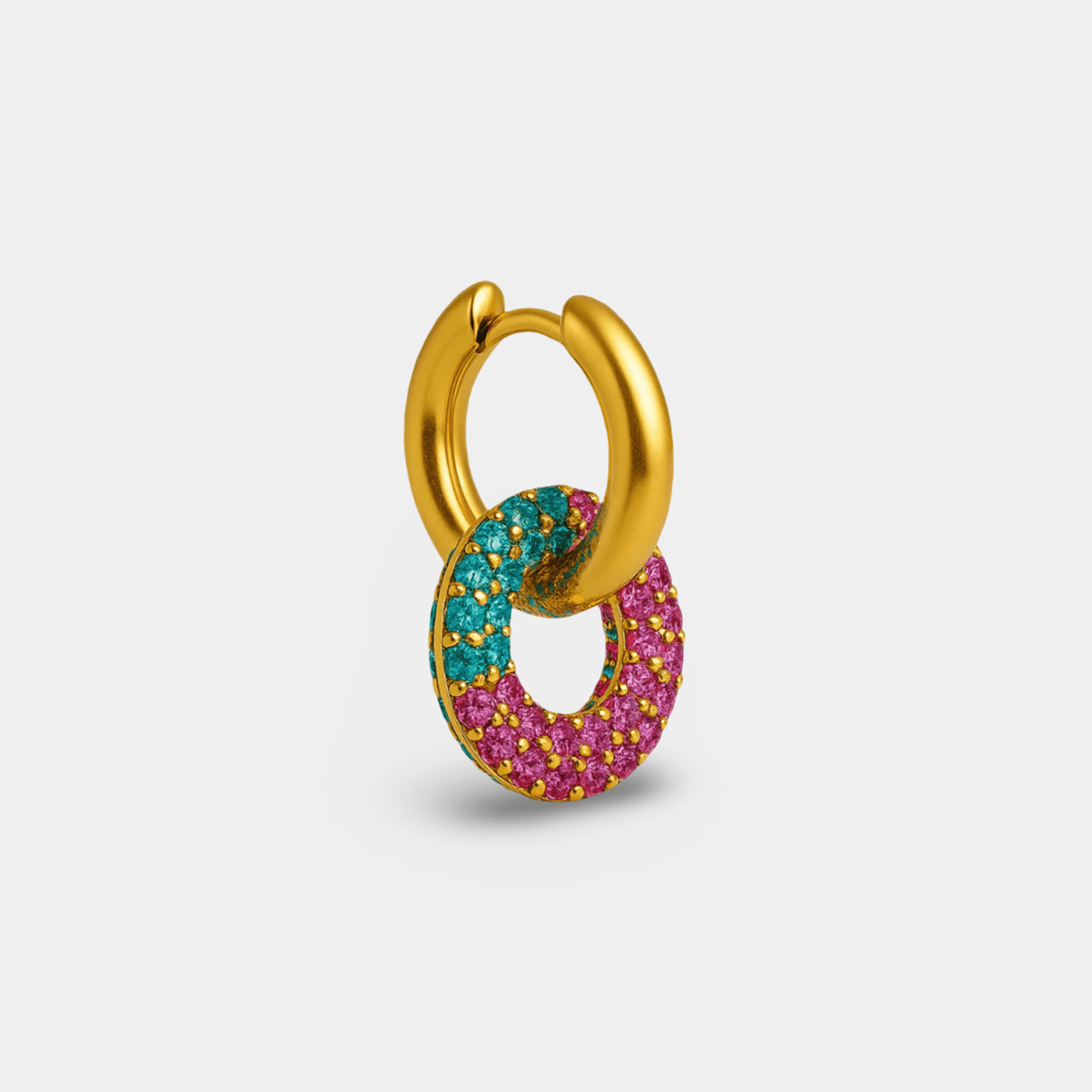 Side angle of a single rainbow zircon gold huggie hoop with donut charm dangling from the hinge