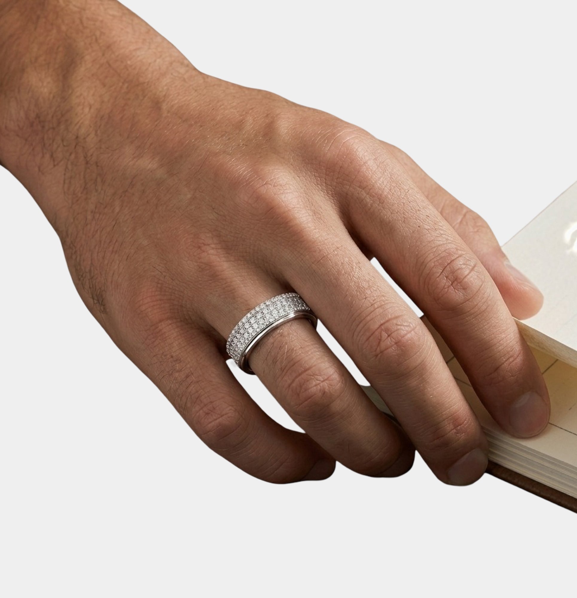White gold plated men's moissanite ring shown at an angle to show the sparkle