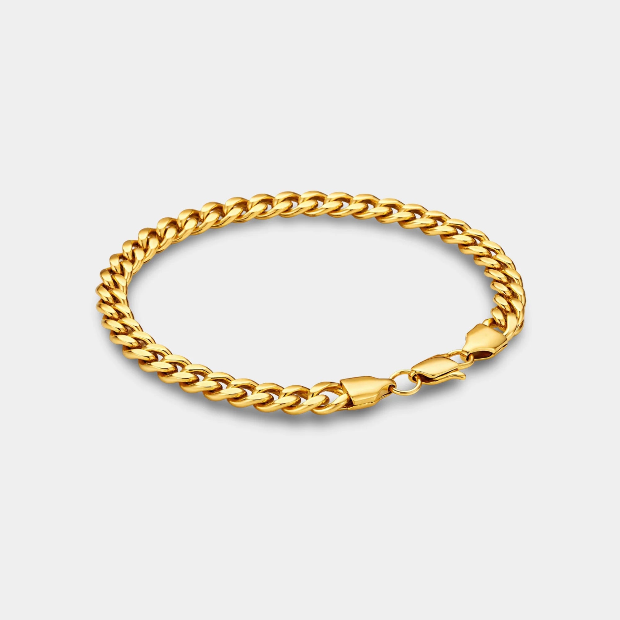Miami Cuban link bracelet for men in 6mm 18K gold-plated stainless steel laid flat to show the bold gold links