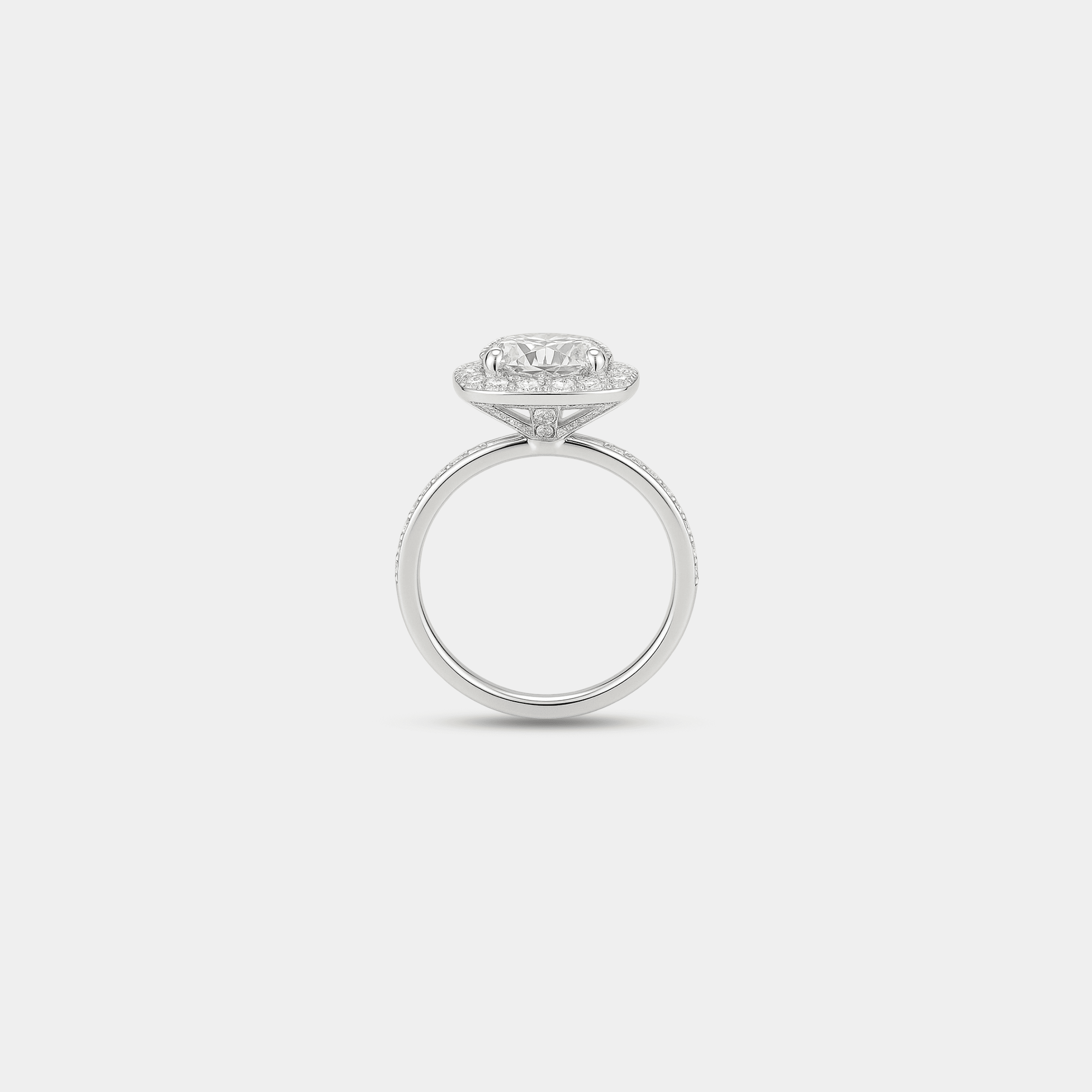 Side profile of the halo engagement ring standing upright, showing the halo height and slim pavé band