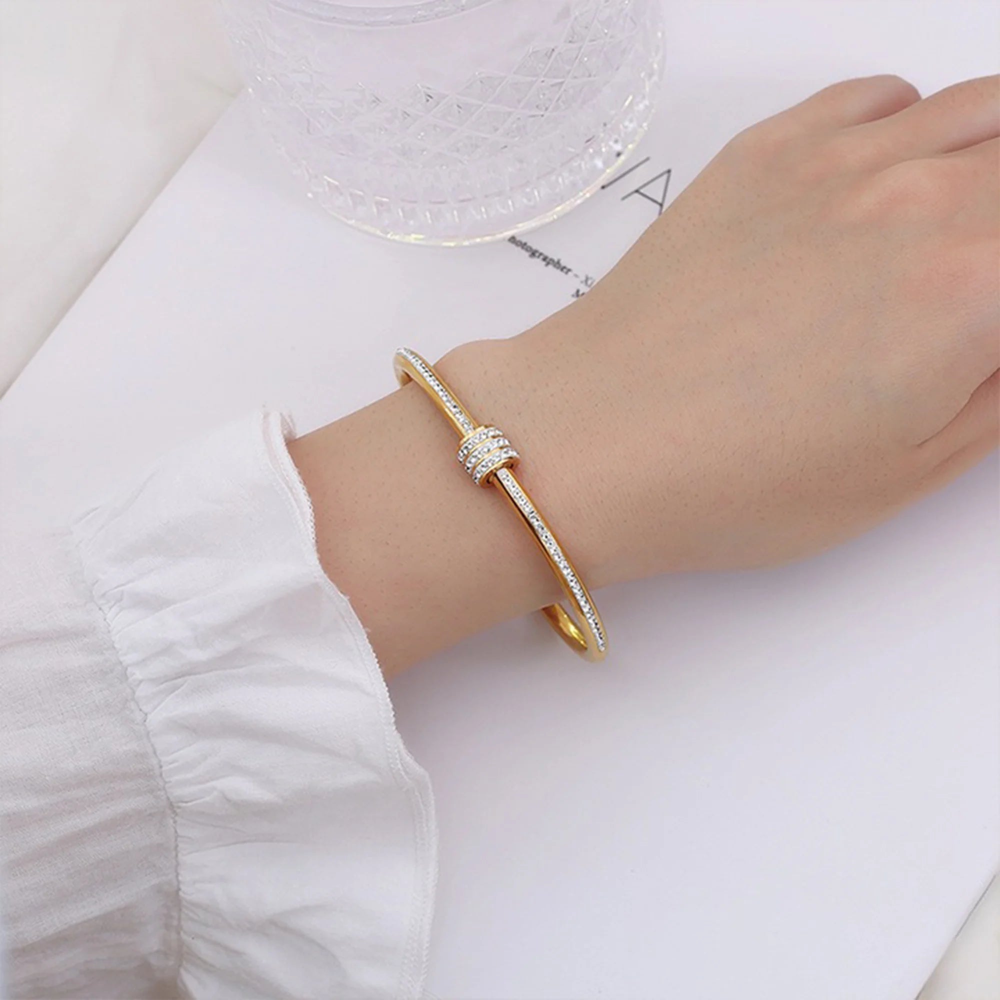 Modern gold crystal bracelet worn on the wrist as an everyday or gift piece
