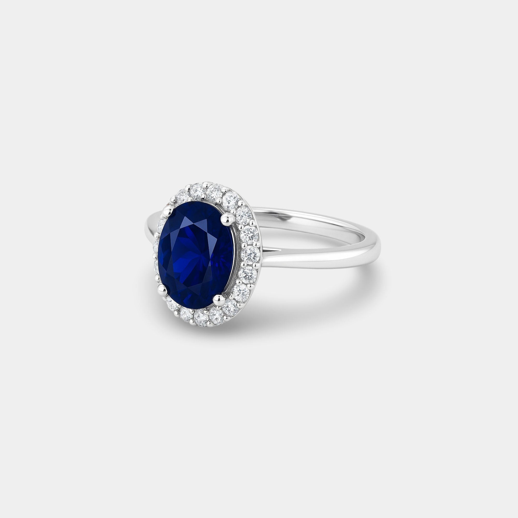 Oval Blue Sapphire & Diamond Halo Ring - MH ELEGANCE - Oval Blue Sapphire & Diamond Halo Ring - MH ELEGANCE -