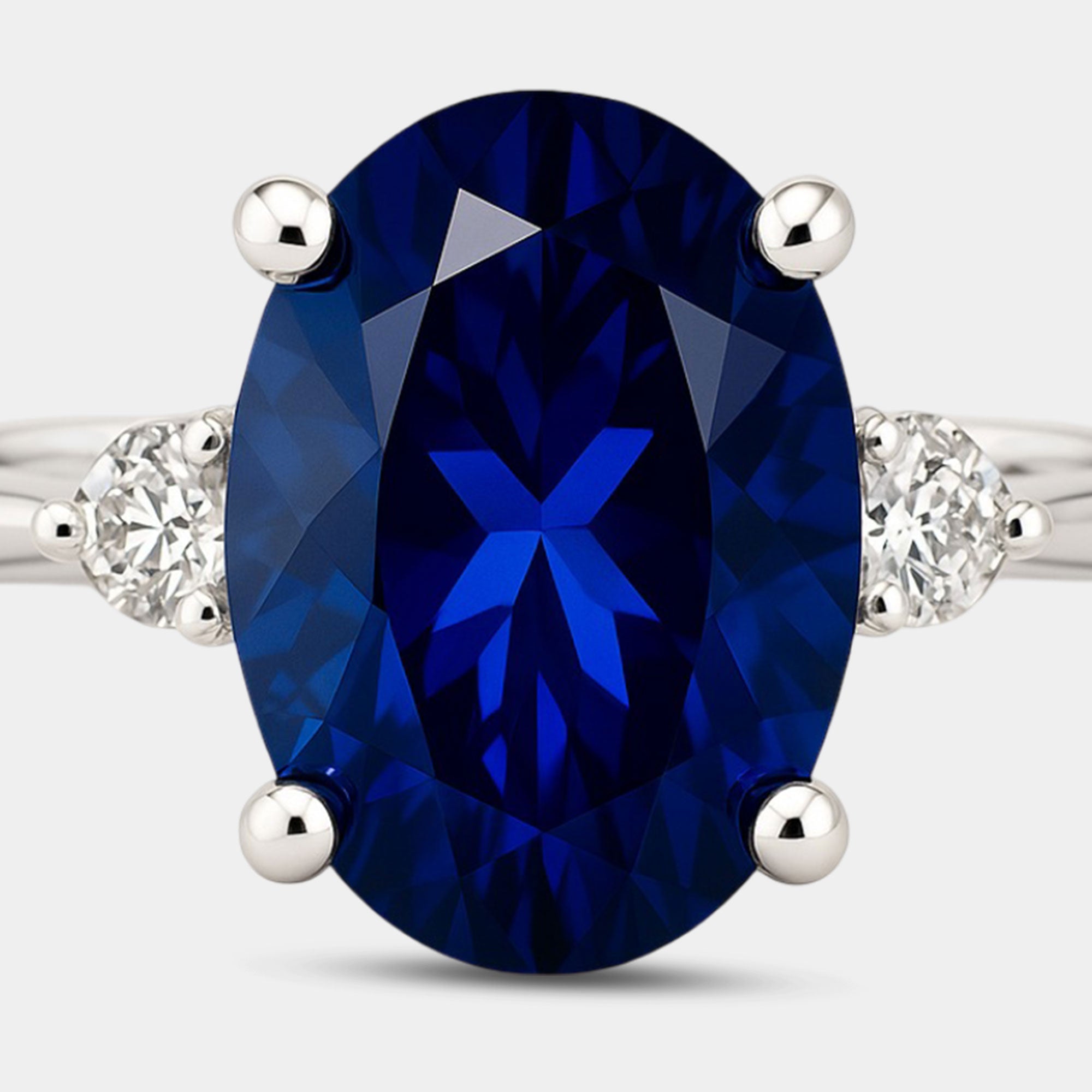Blue sapphire and diamond three-stone ring on the hand as an engagement or promise ring