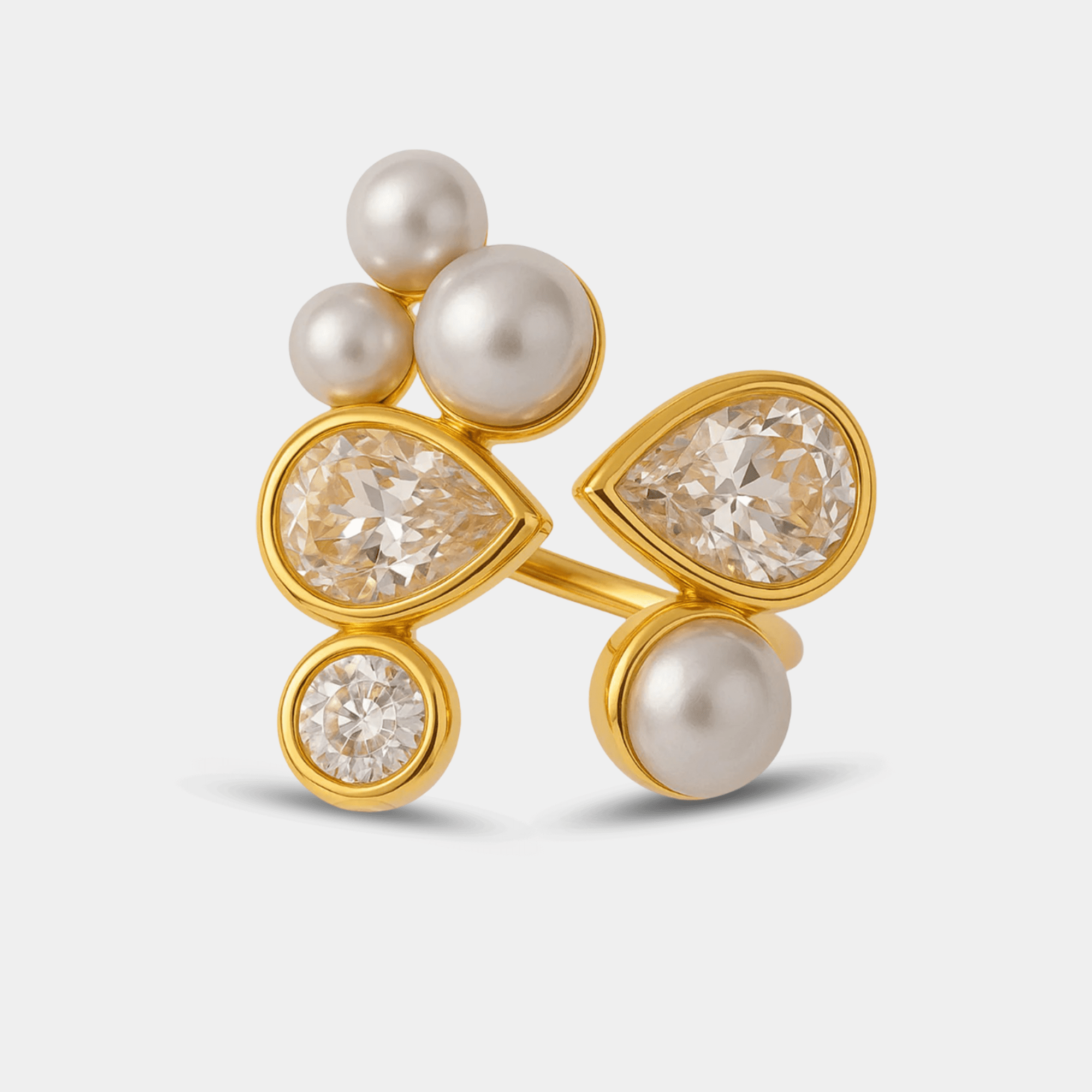 Pearl Prism Galaxy Ring in 18K gold plated stainless steel with an asymmetric cluster of pearls and pear-cut zircon stones