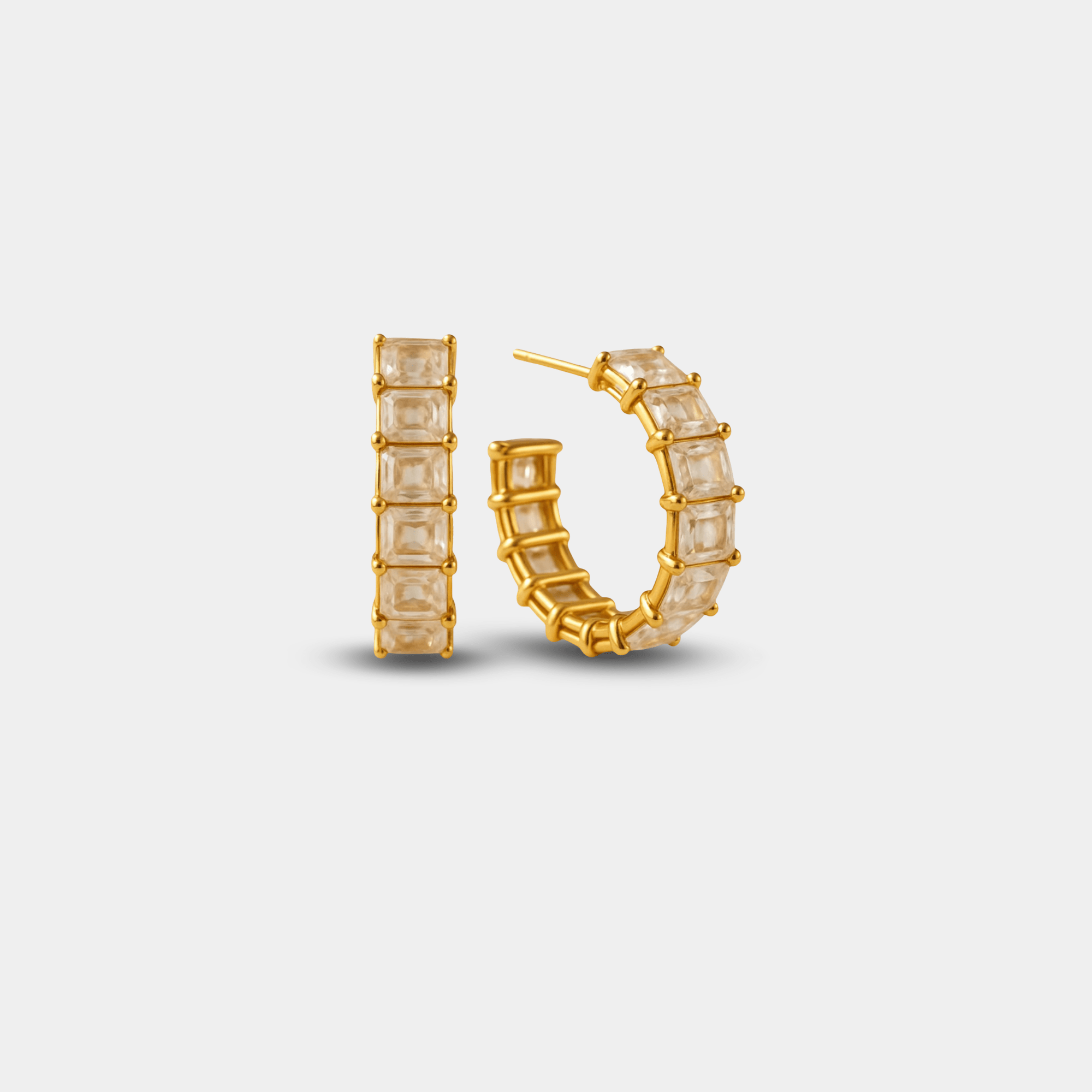 Prism crown hoop earrings in 18K gold-plated stainless steel with a geometric crown design, front view
