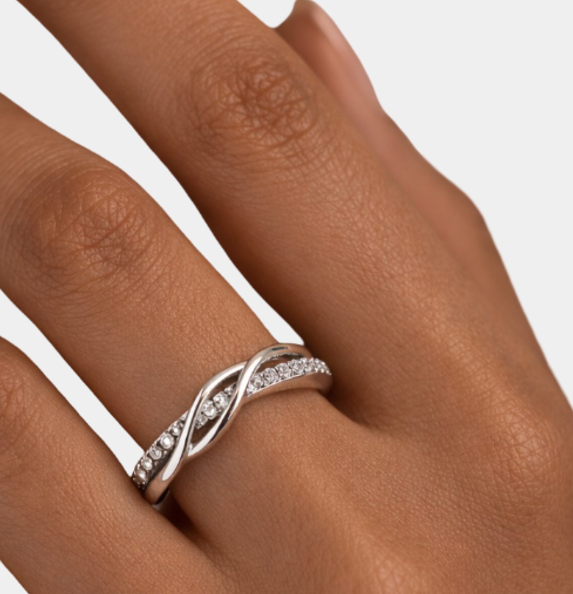Side view of the wave knot statement ring showing the smooth polished band