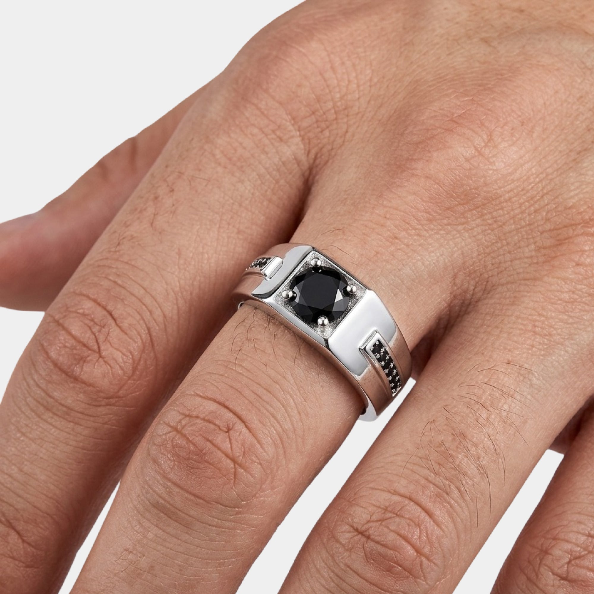 Black stone men's wedding ring in silver, top view of the full band