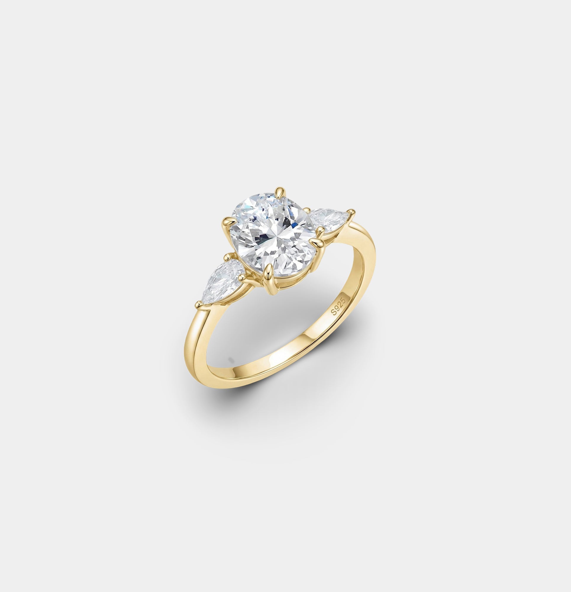 Sterling silver three stone engagement ring with a tapered band, detail view