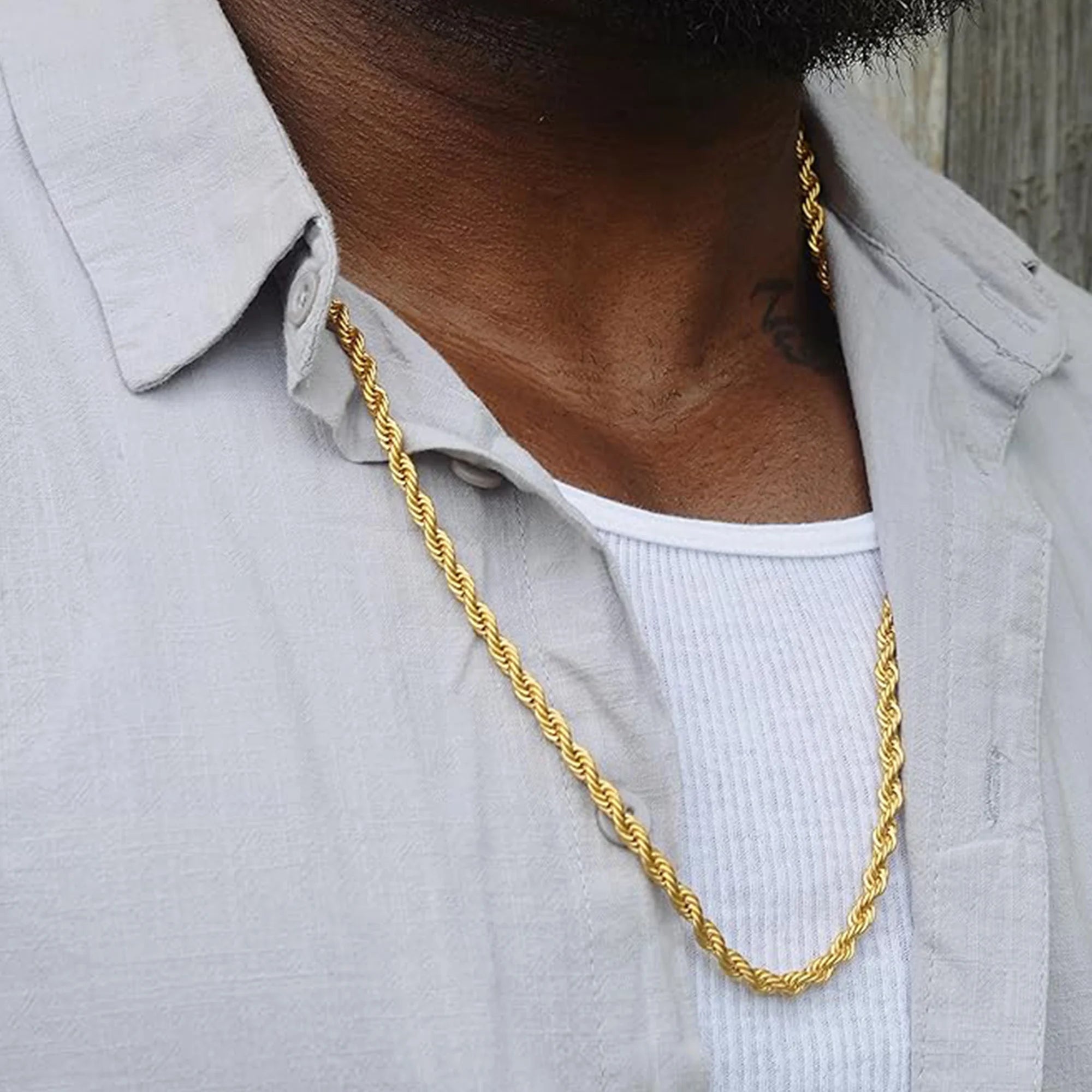 Twist rope chain necklace worn around the neck showing the gold chain for men and women