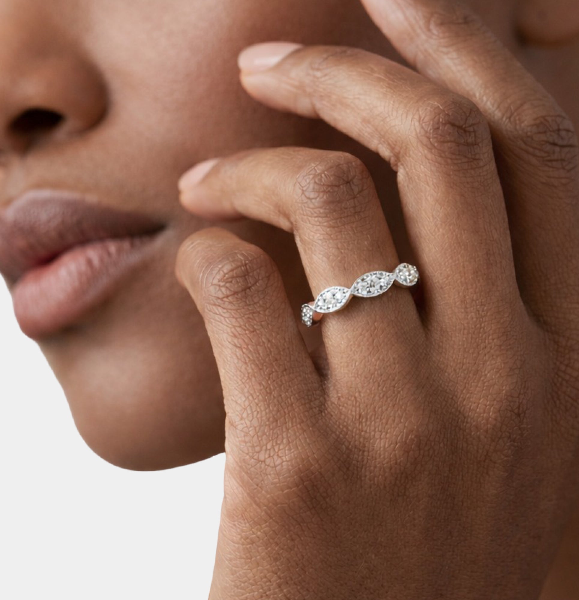 Vintage milgrain CZ eternity band close-up showing the marquise-shaped frames