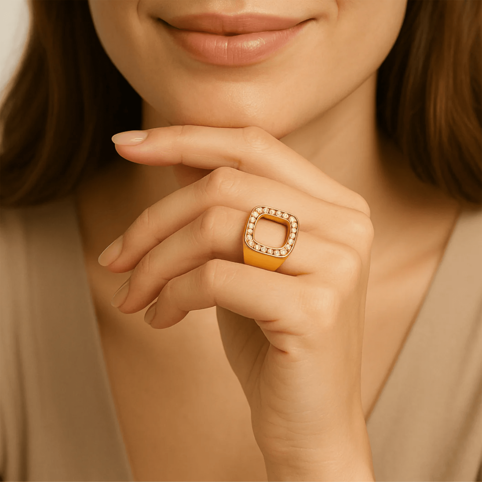 Woman wearing the gold square cutout zircon ring on her hand near her chin, lifestyle photo